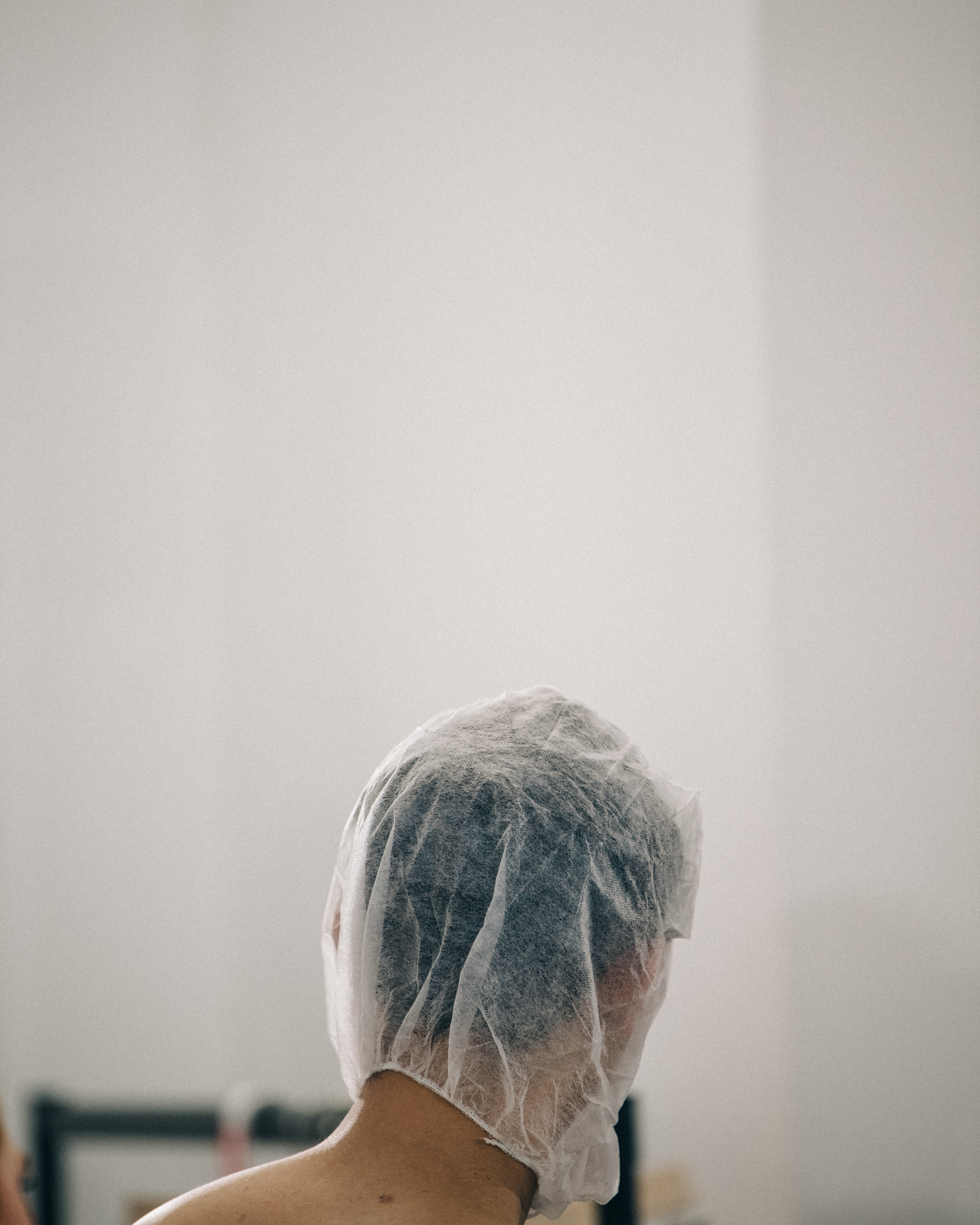 Model wearing hair net backstage