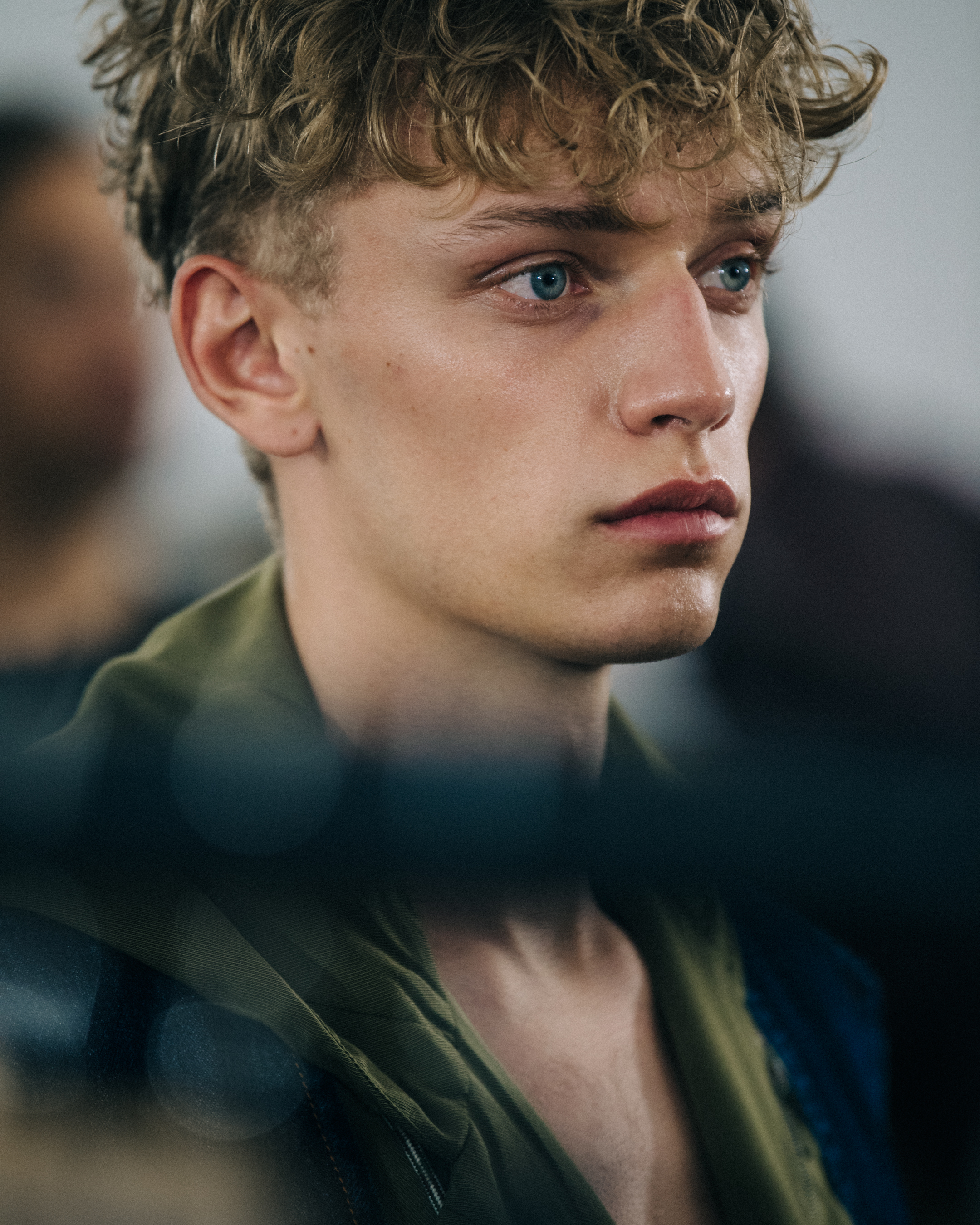 Model with curly blonde hair