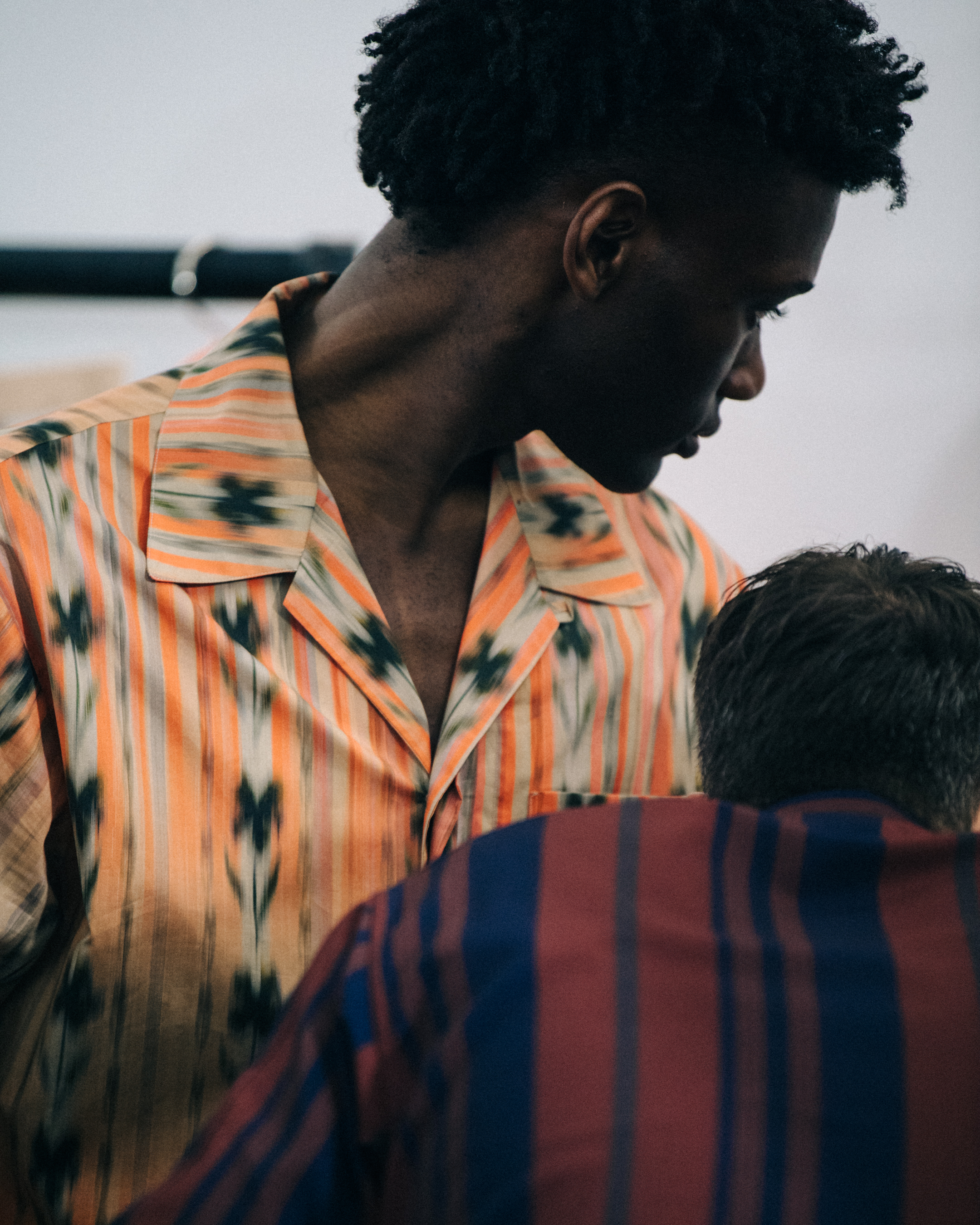 Model wearing pattern shirt at Qasimi