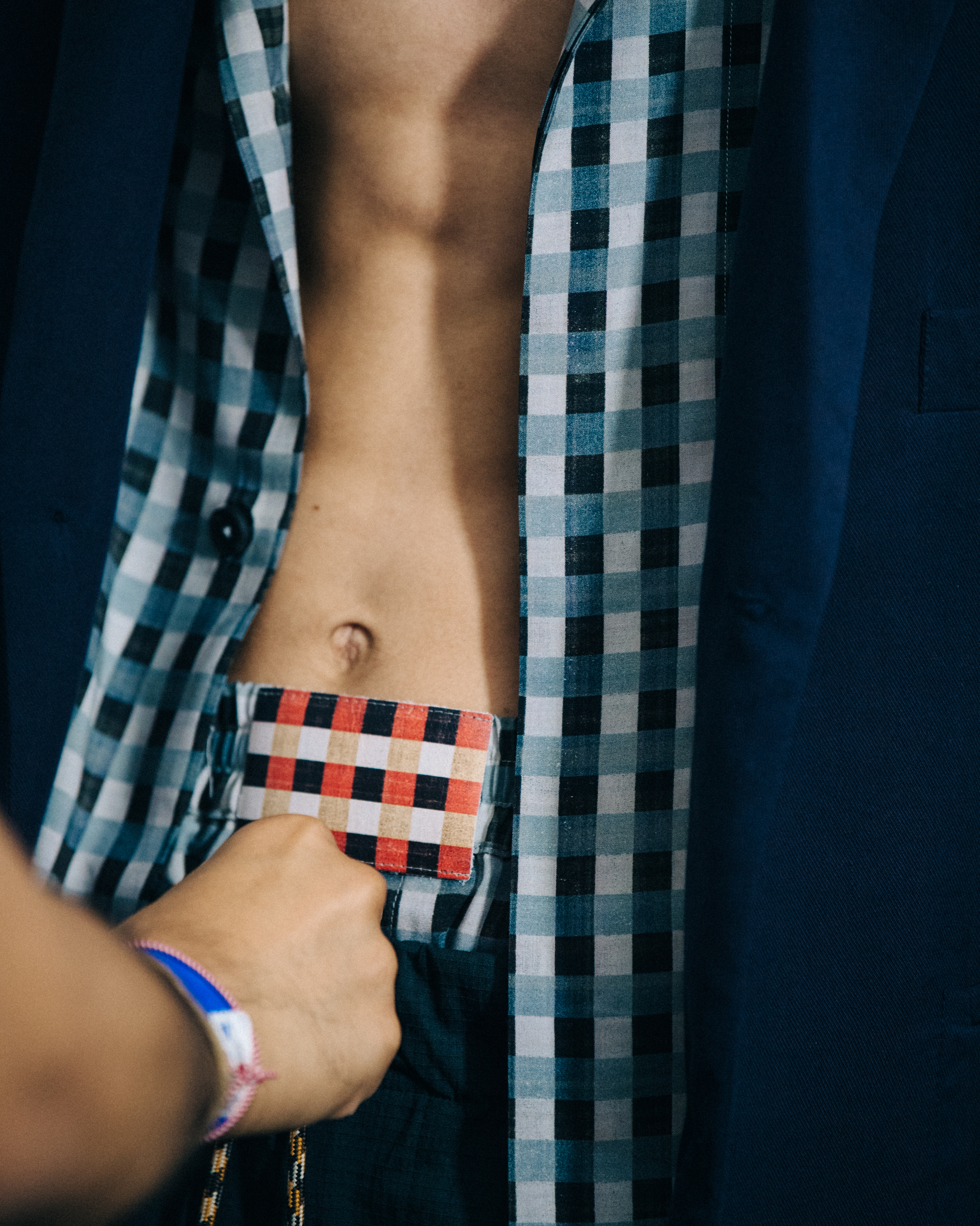 Model wearing check pattern at Qasimi