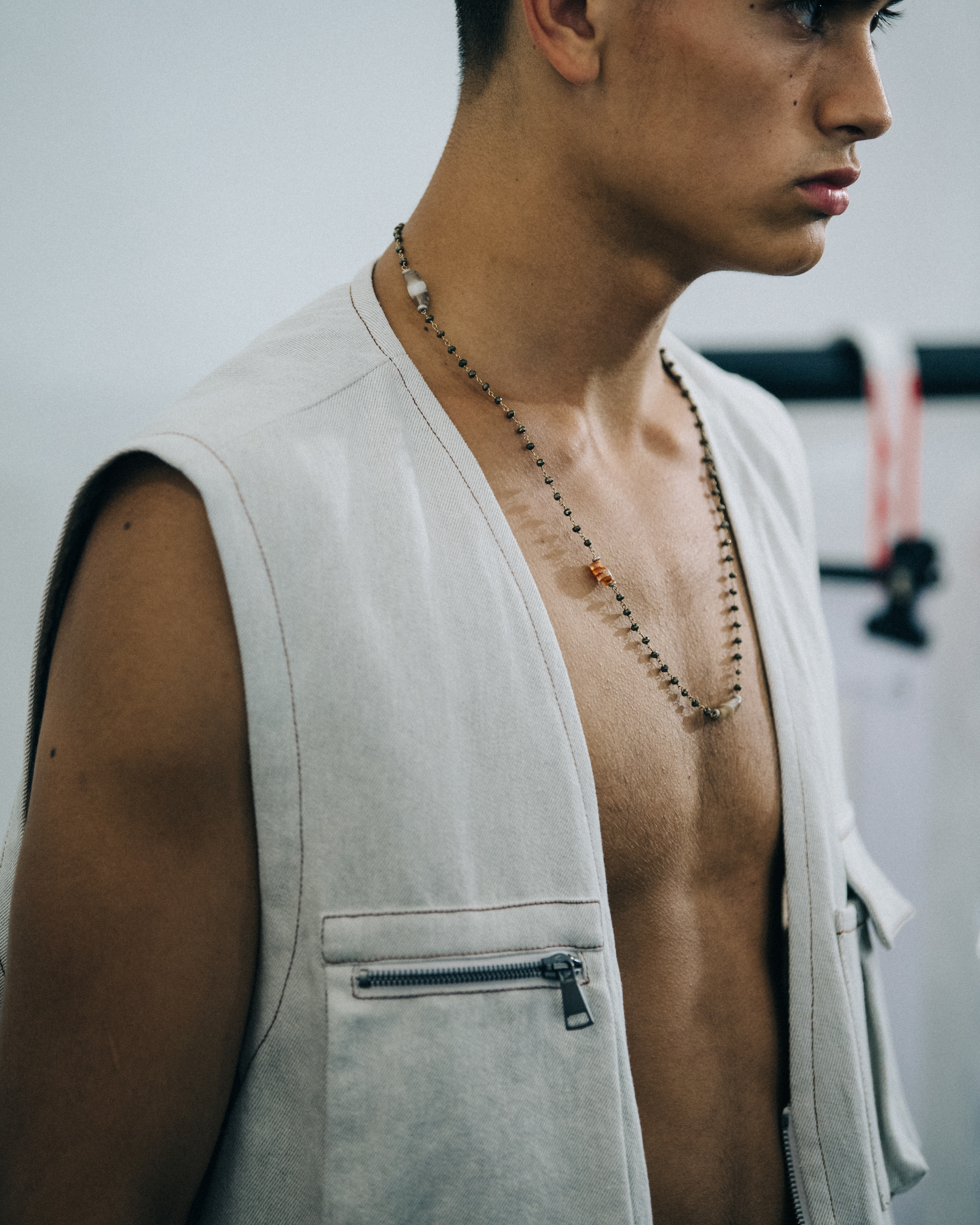 Topless model backstage at Qasimi