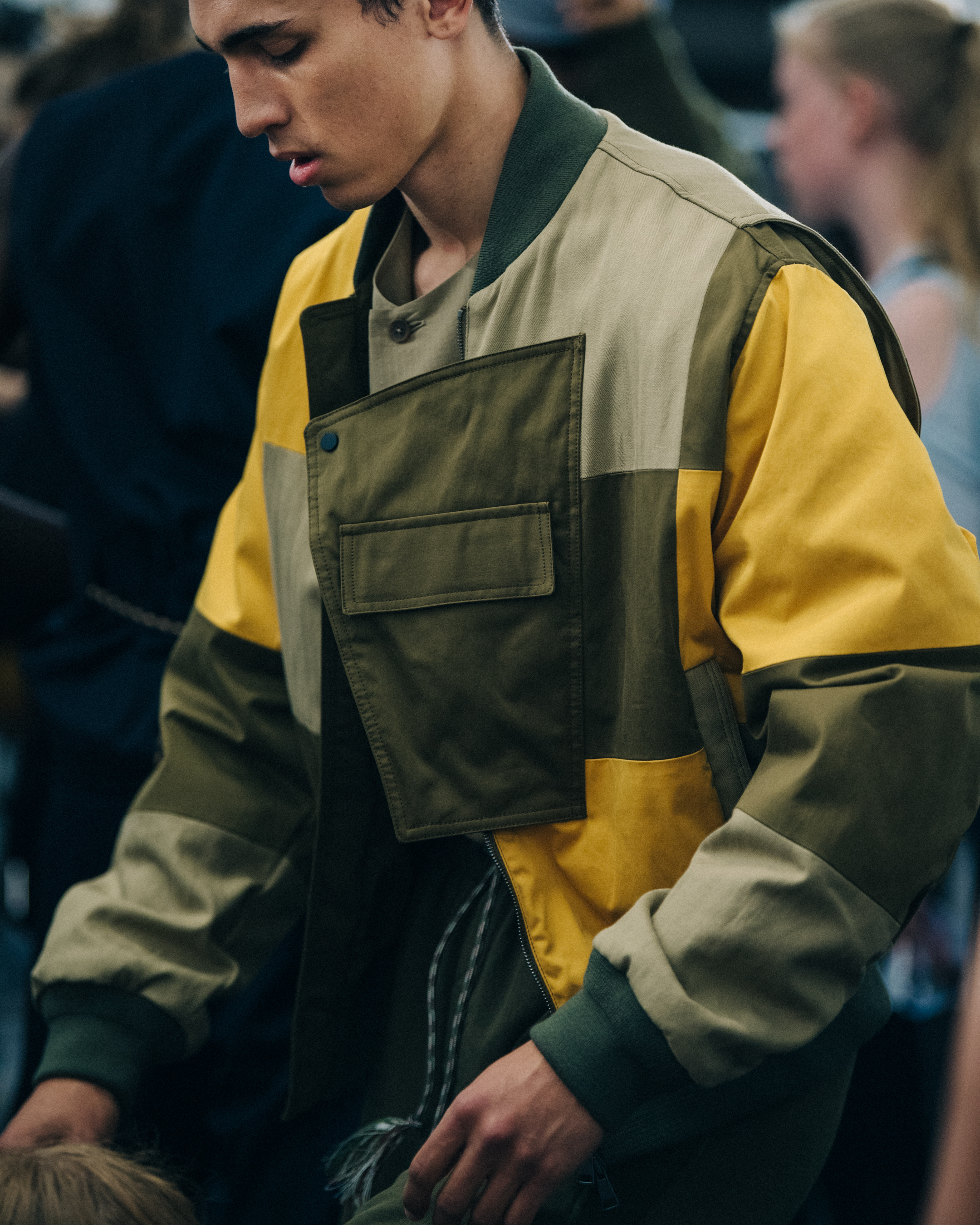 Model wearing colourful panel jacket