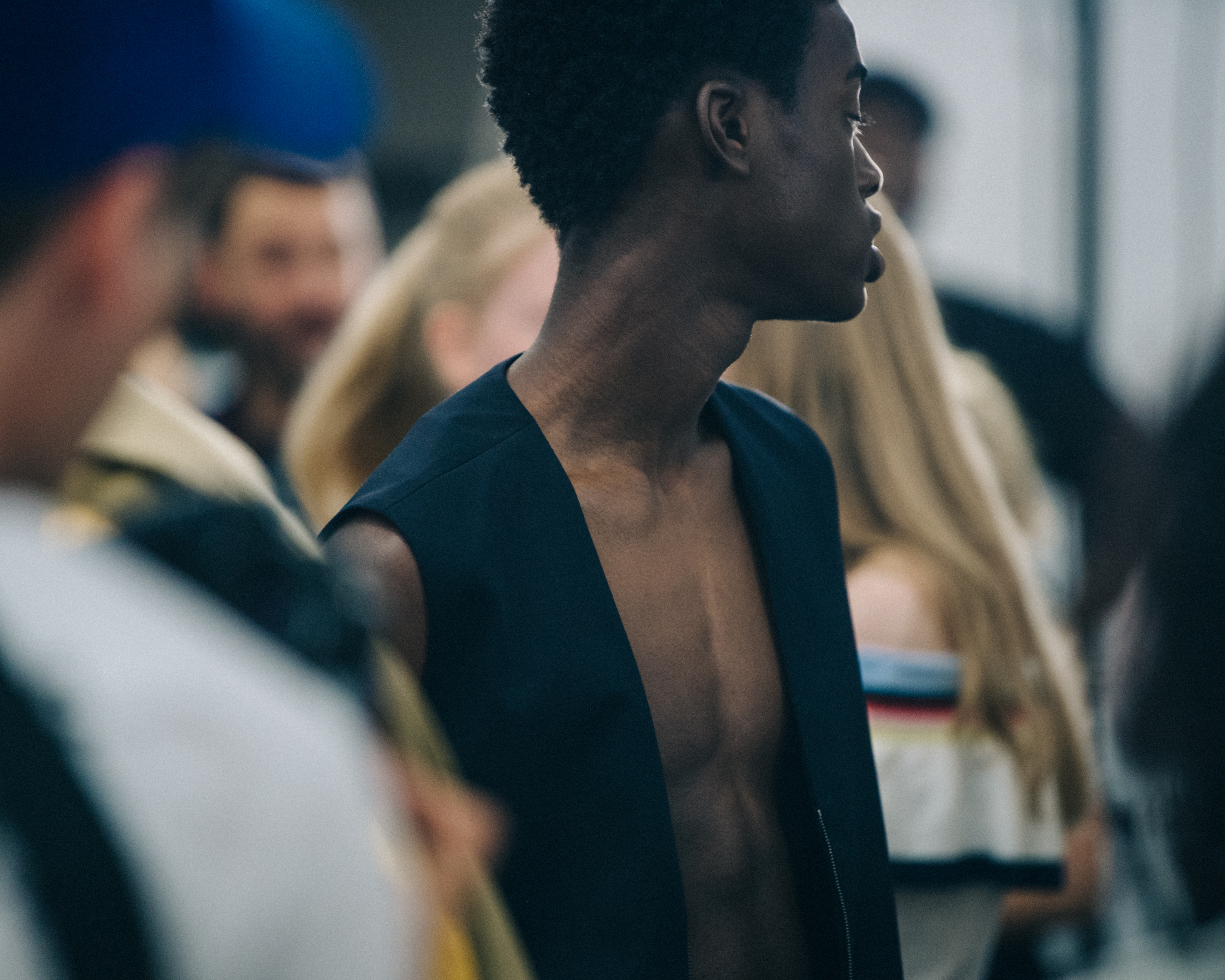 Topless model backstage at Qasimi