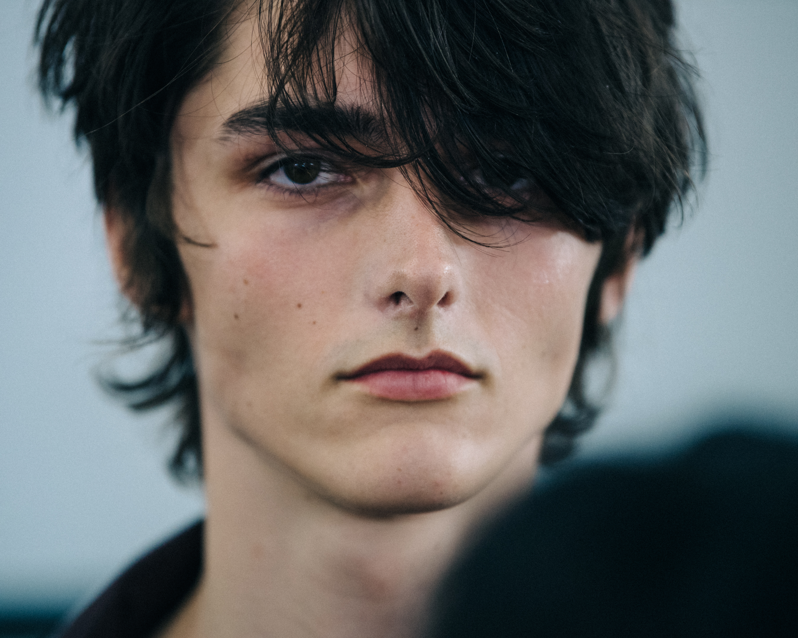 Model with brown fringe at Qasimi