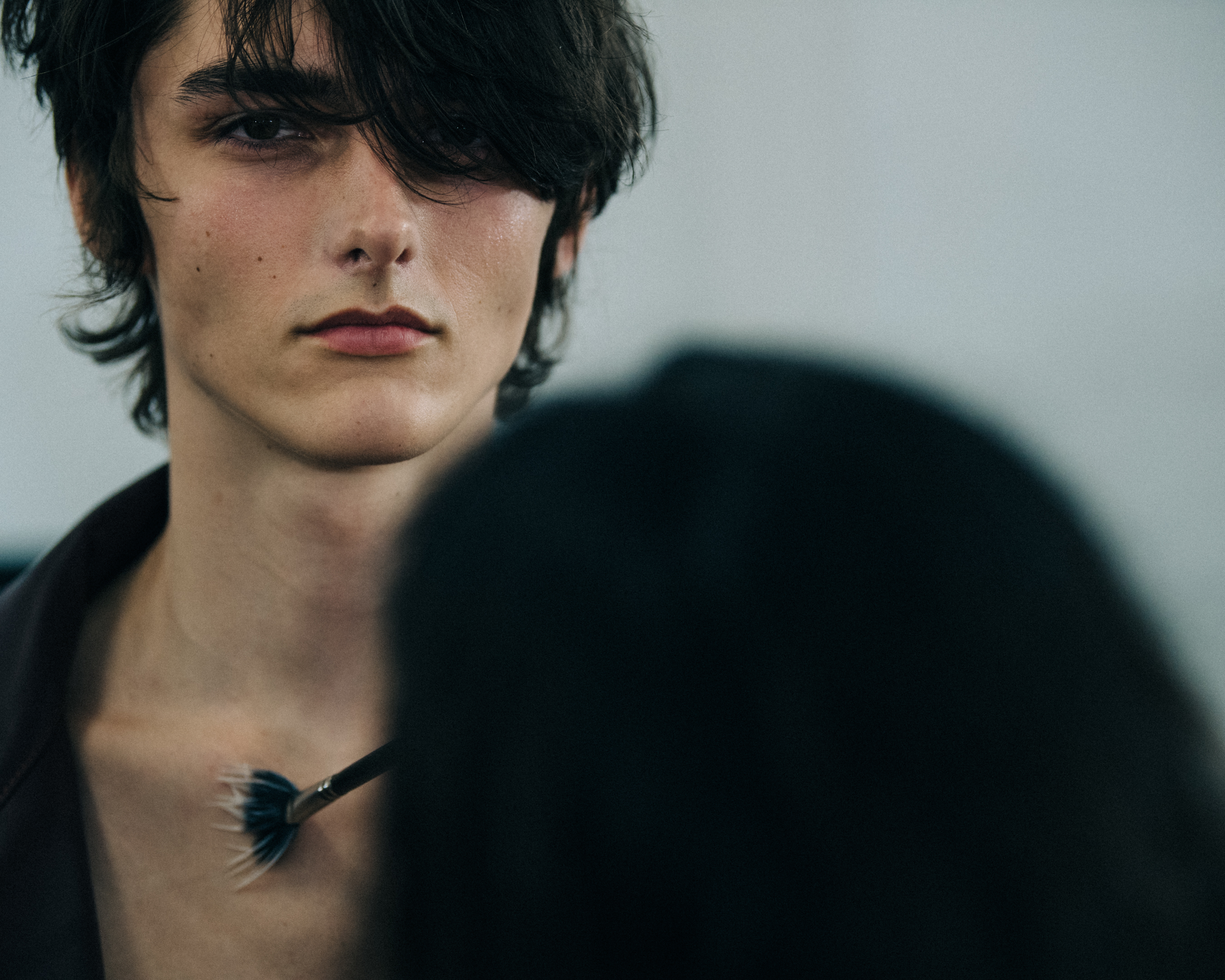 Model with brown fringe at Qasimi