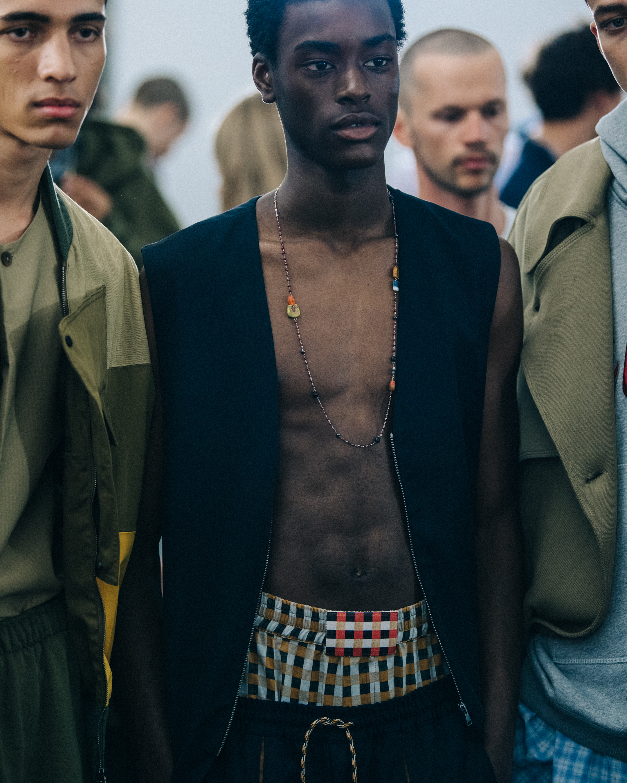 Topless model backstage at Qasimi
