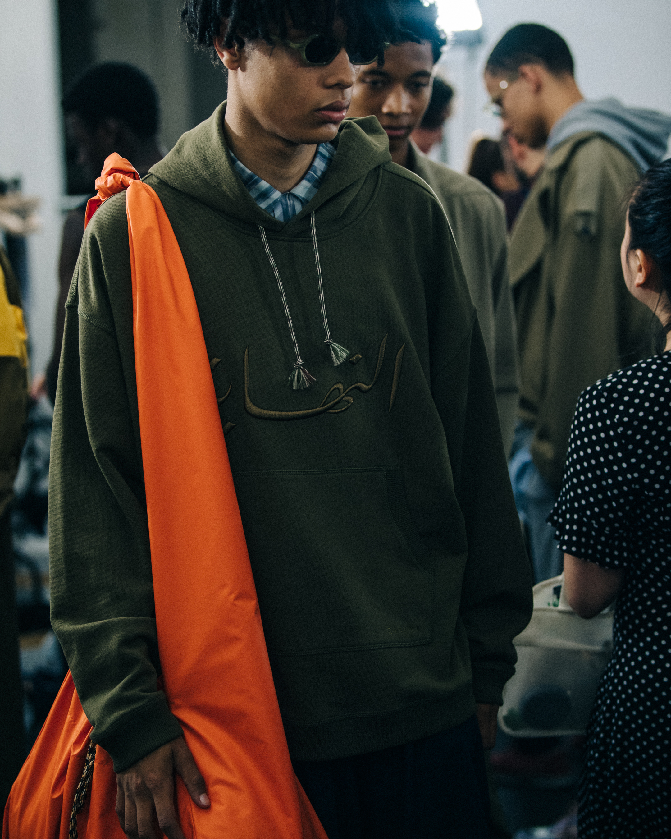 Models wearing hoodies at Qasimi