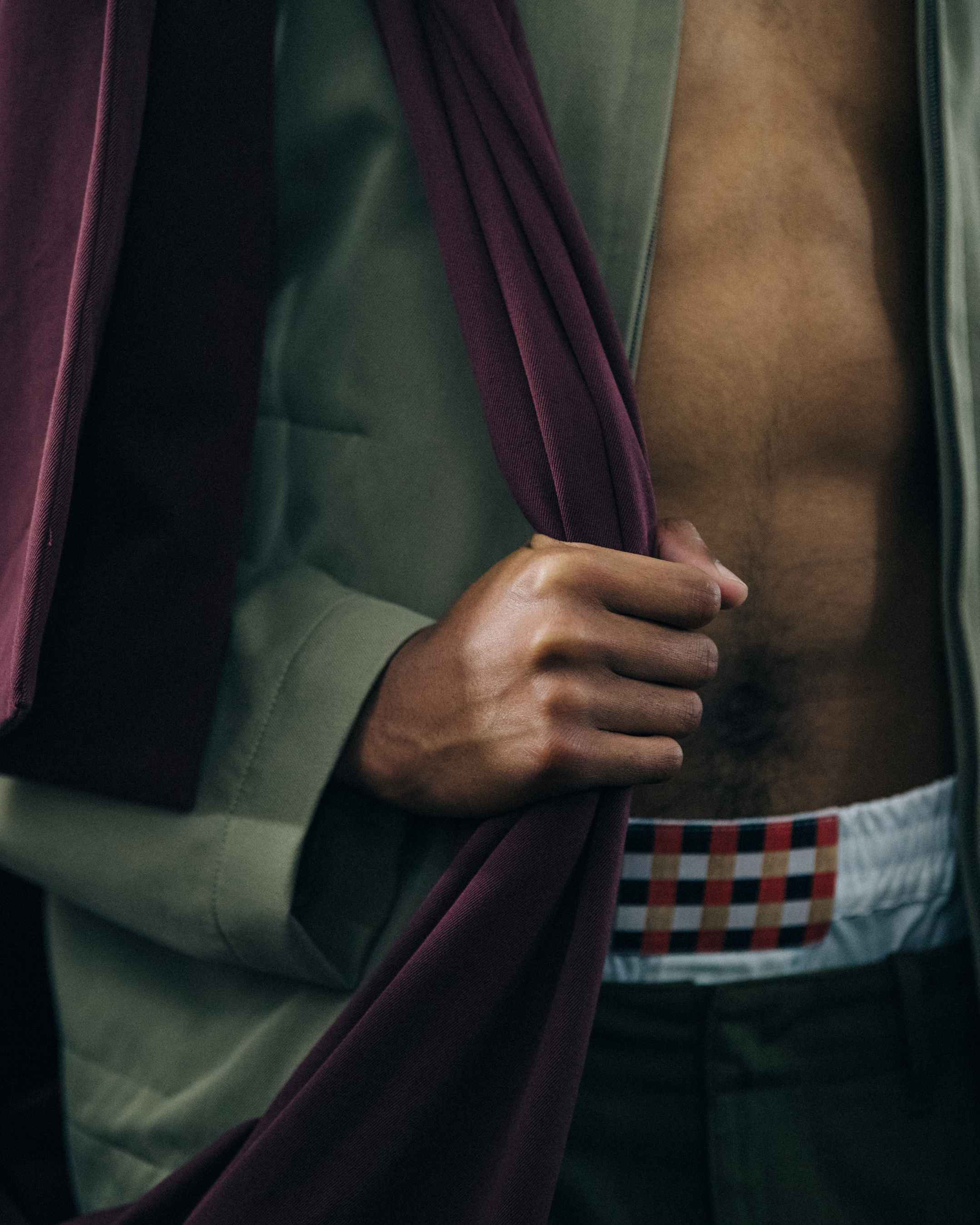 Topless model backstage at Qasimi