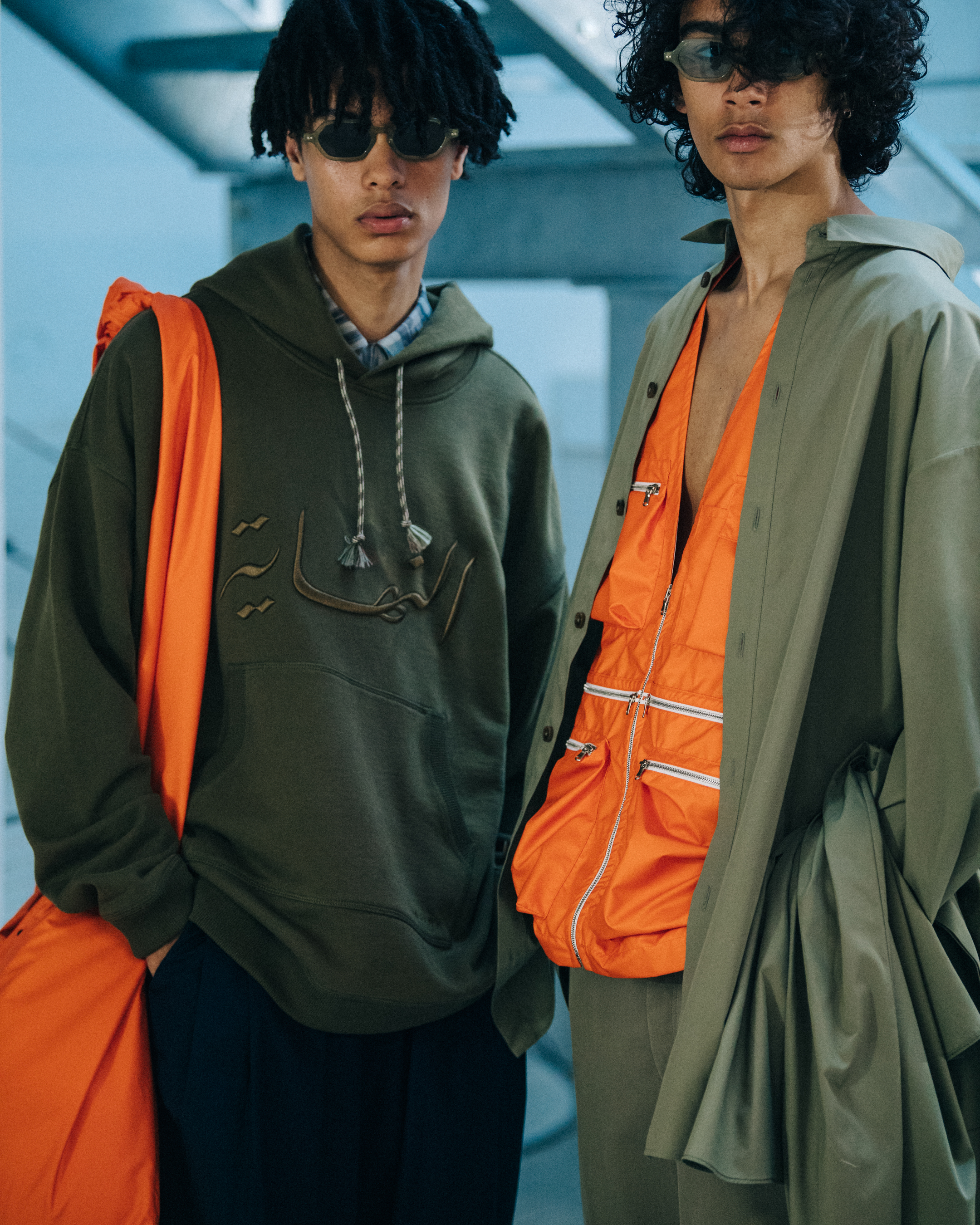 Models wearing hoodies at Qasimi