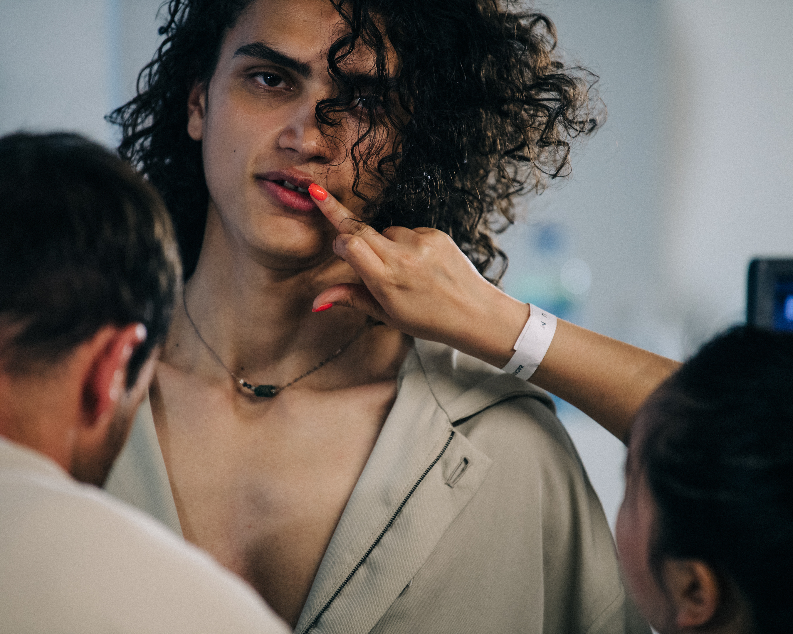 Topless model backstage at Qasimi