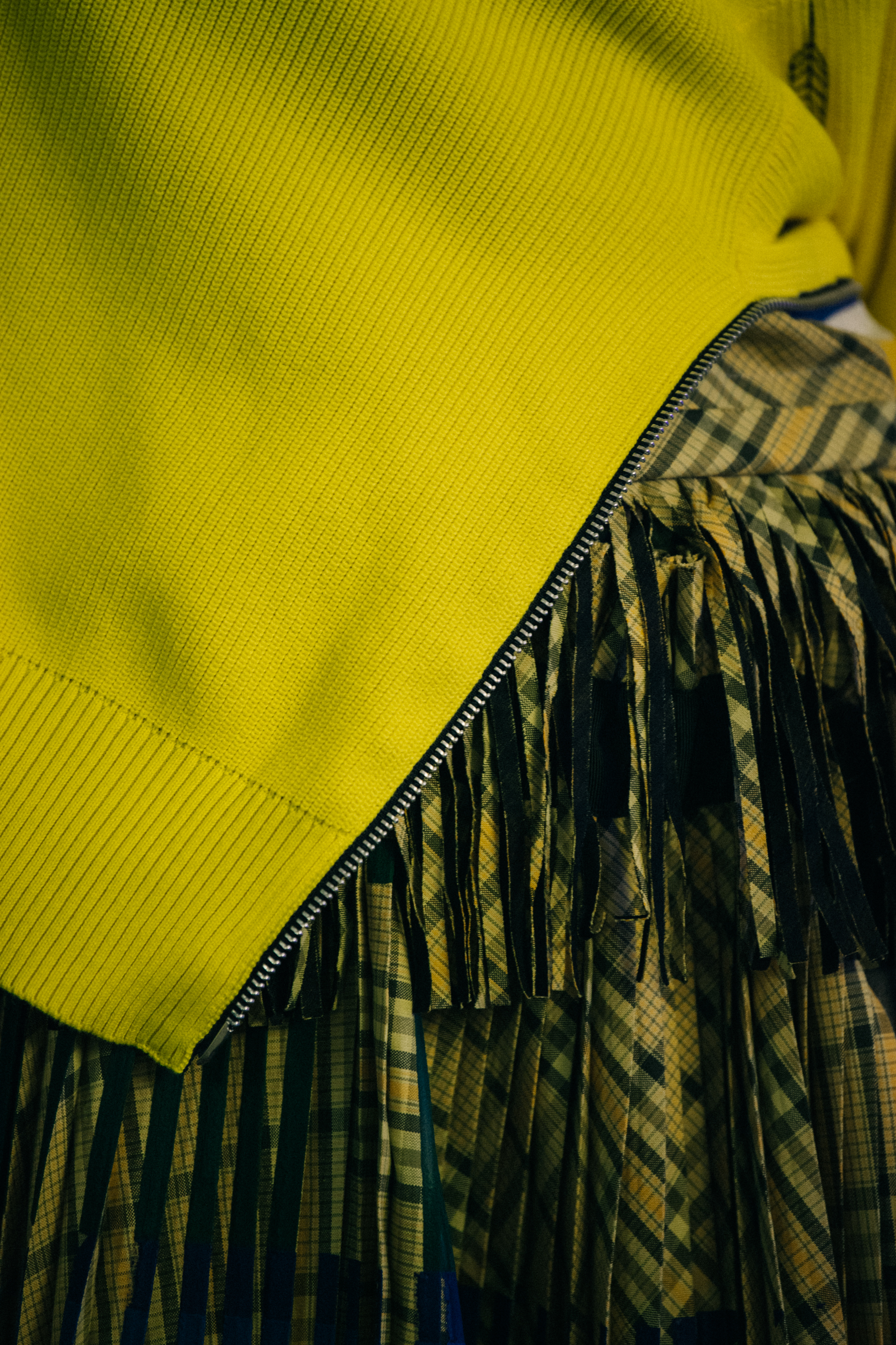 Model wearing yellow Sacai outfit