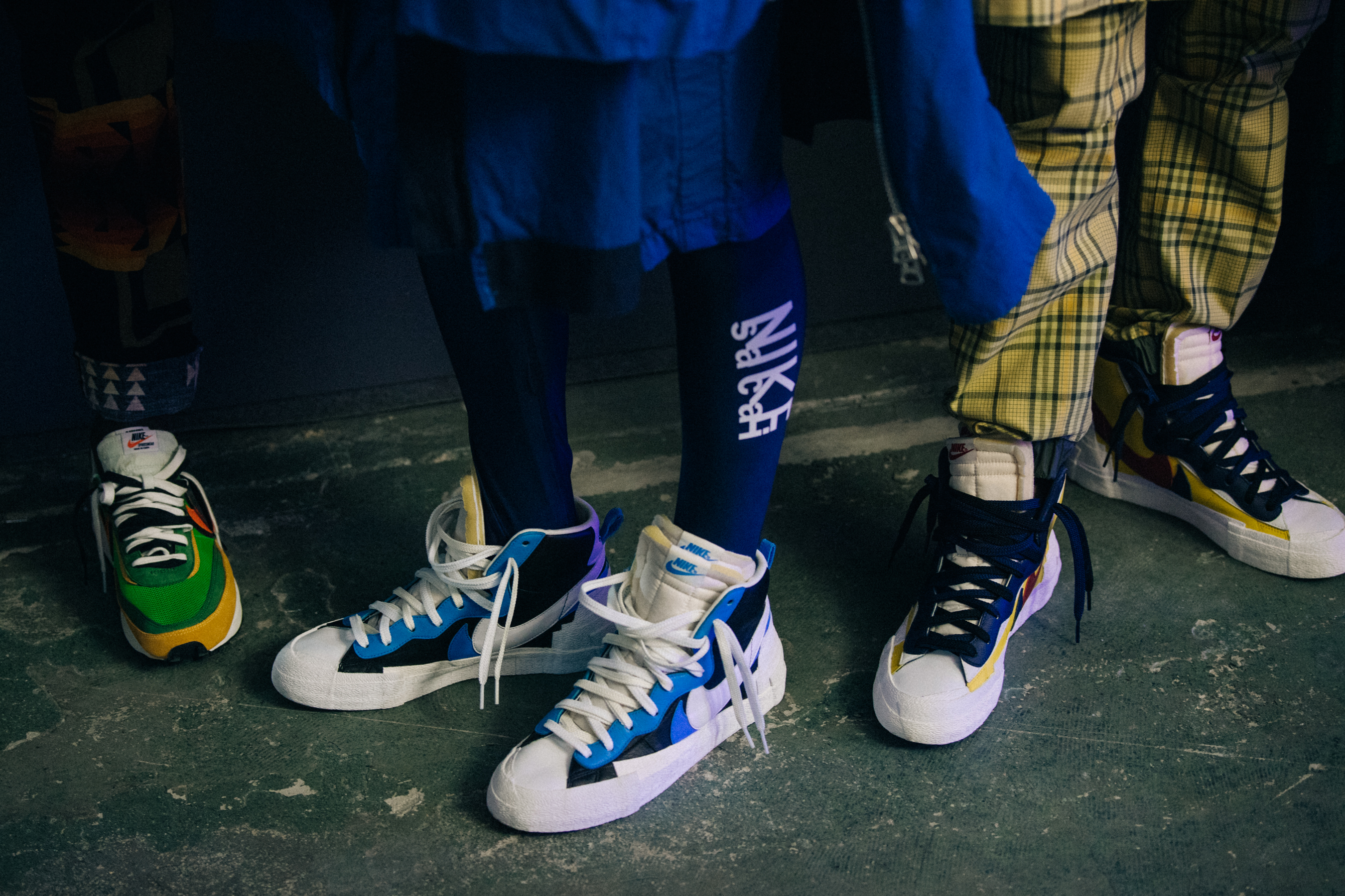 Models wearing Nike x Sacai sneakers