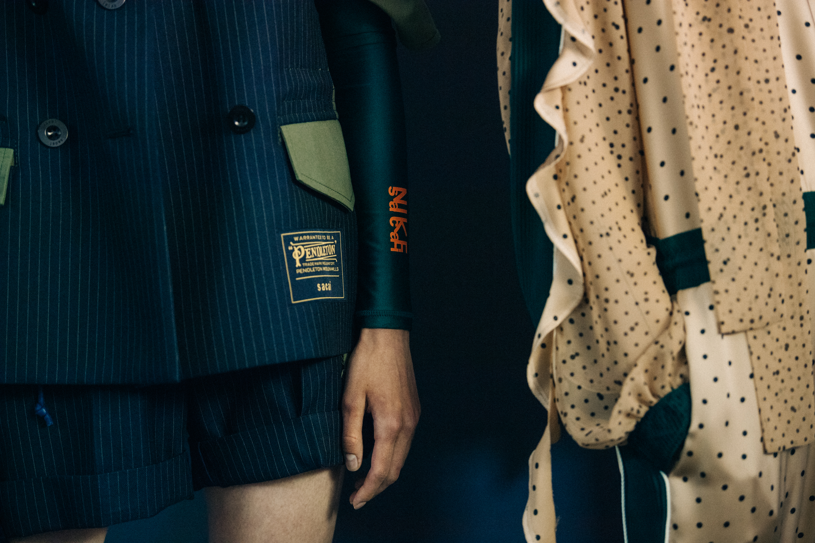 Models wearing Sacai x Pendleton outfits