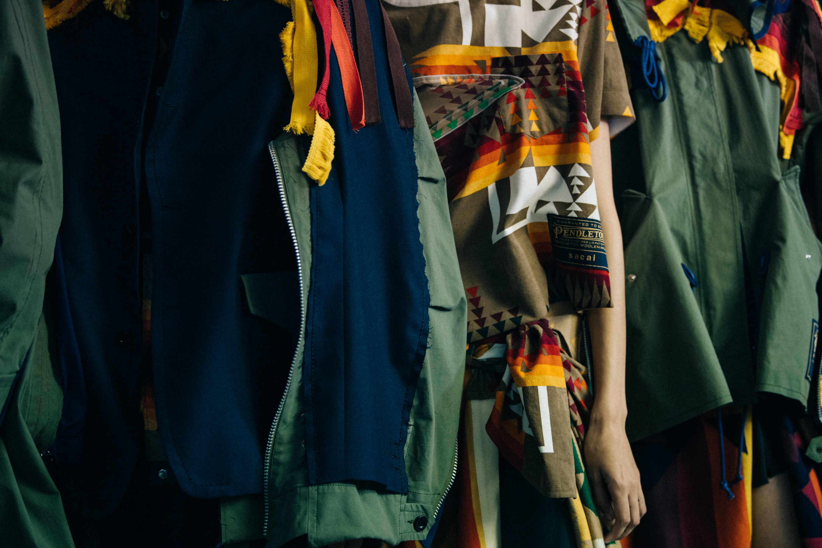 Models wearing Sacai x Pendleton outfits