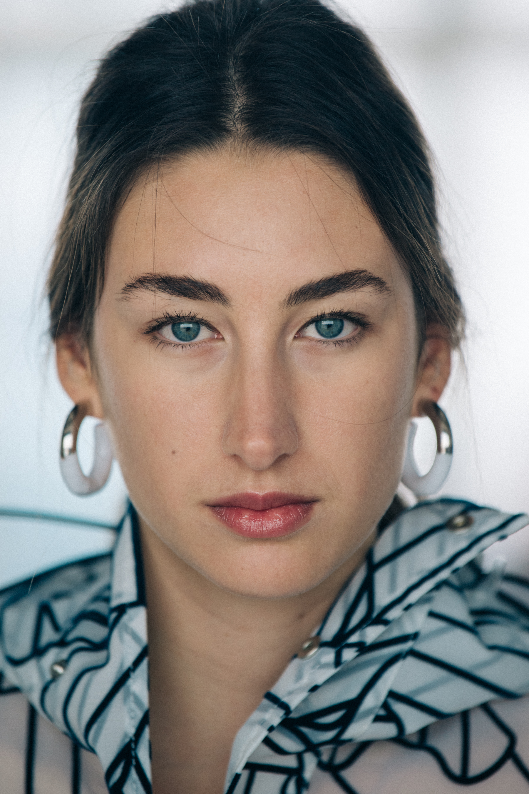 Portrait of model wearing silver earrings