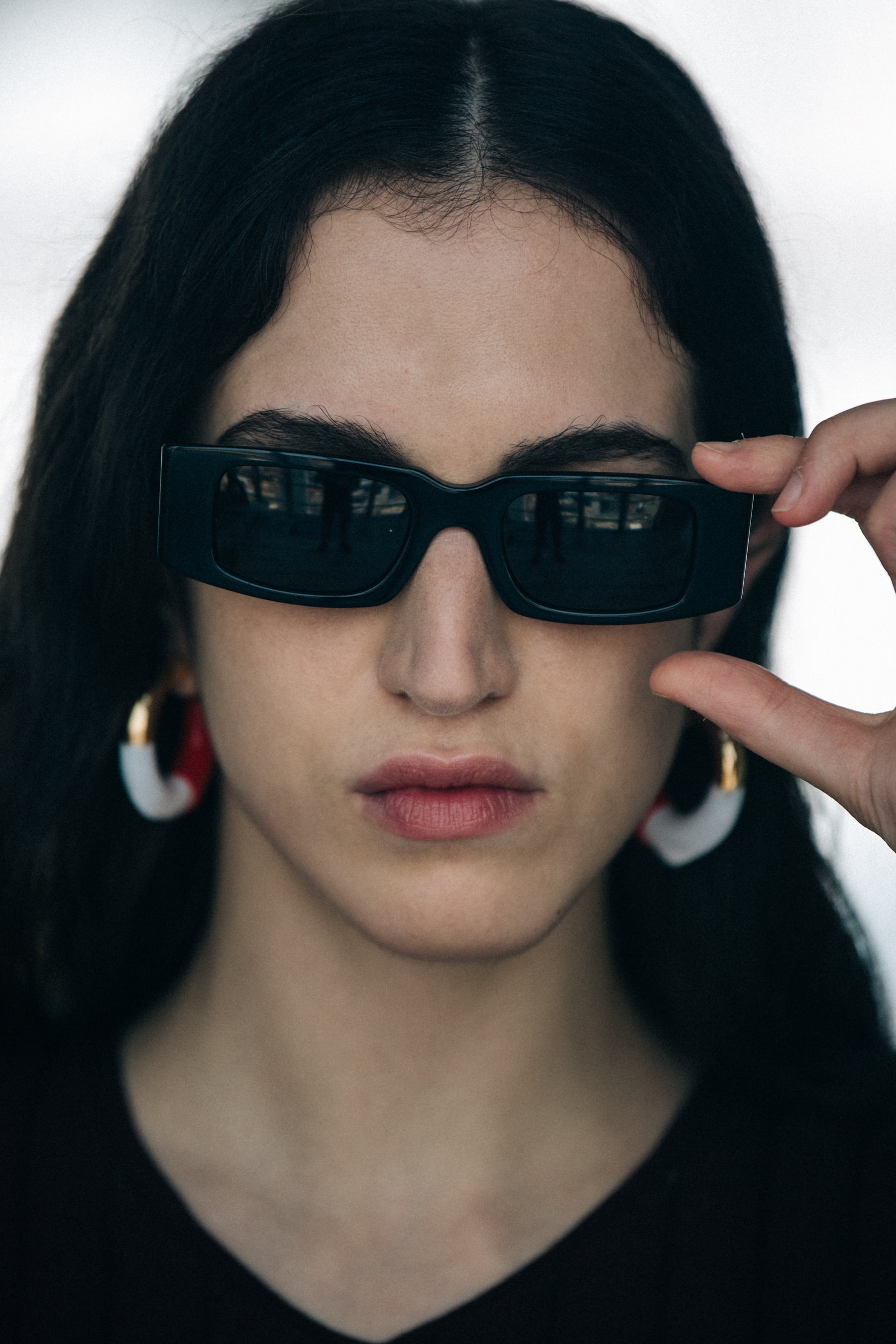 Portrait of model wearing sunglasses at Sunnei