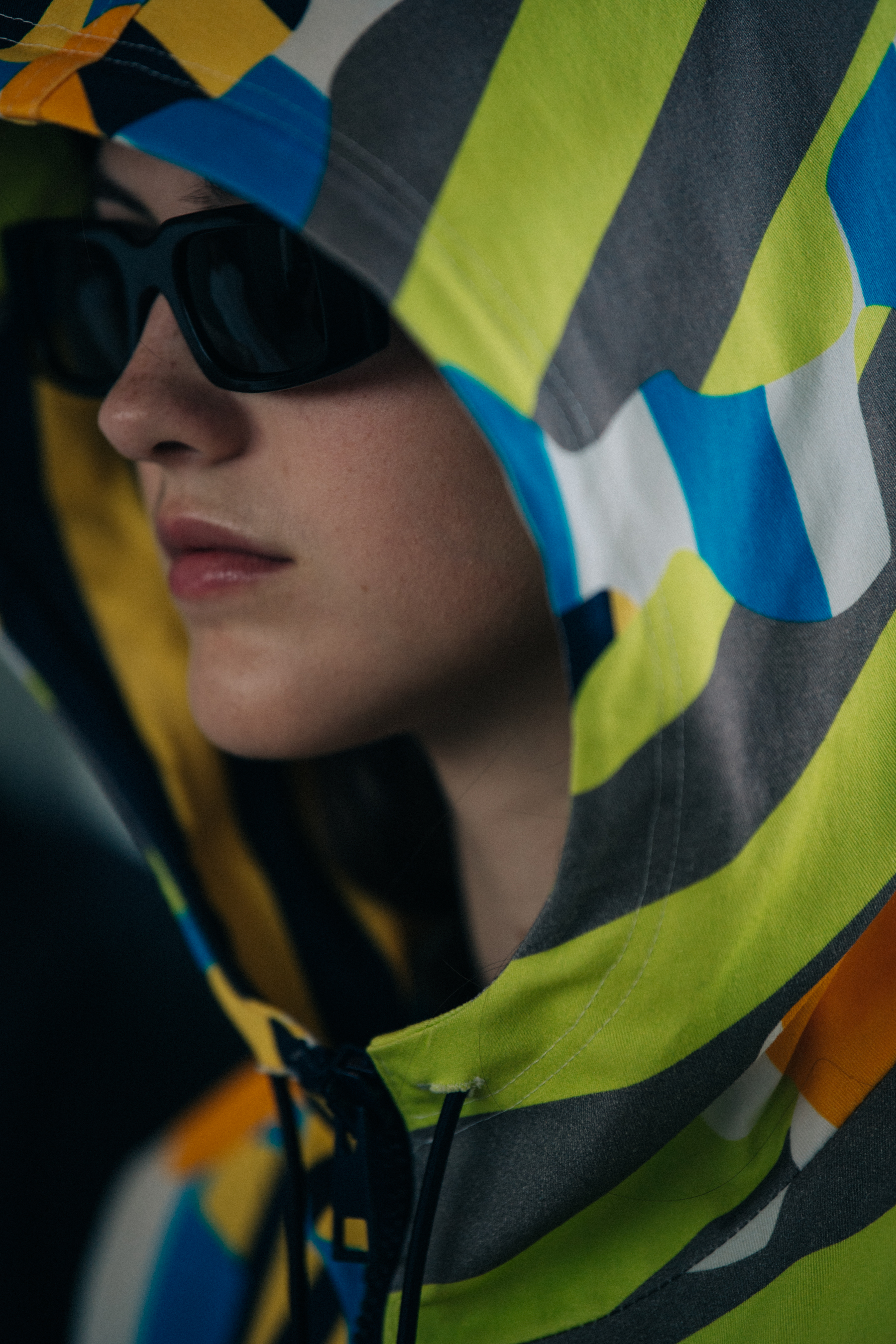 Model wearing sunglasses backstage at Sunnei