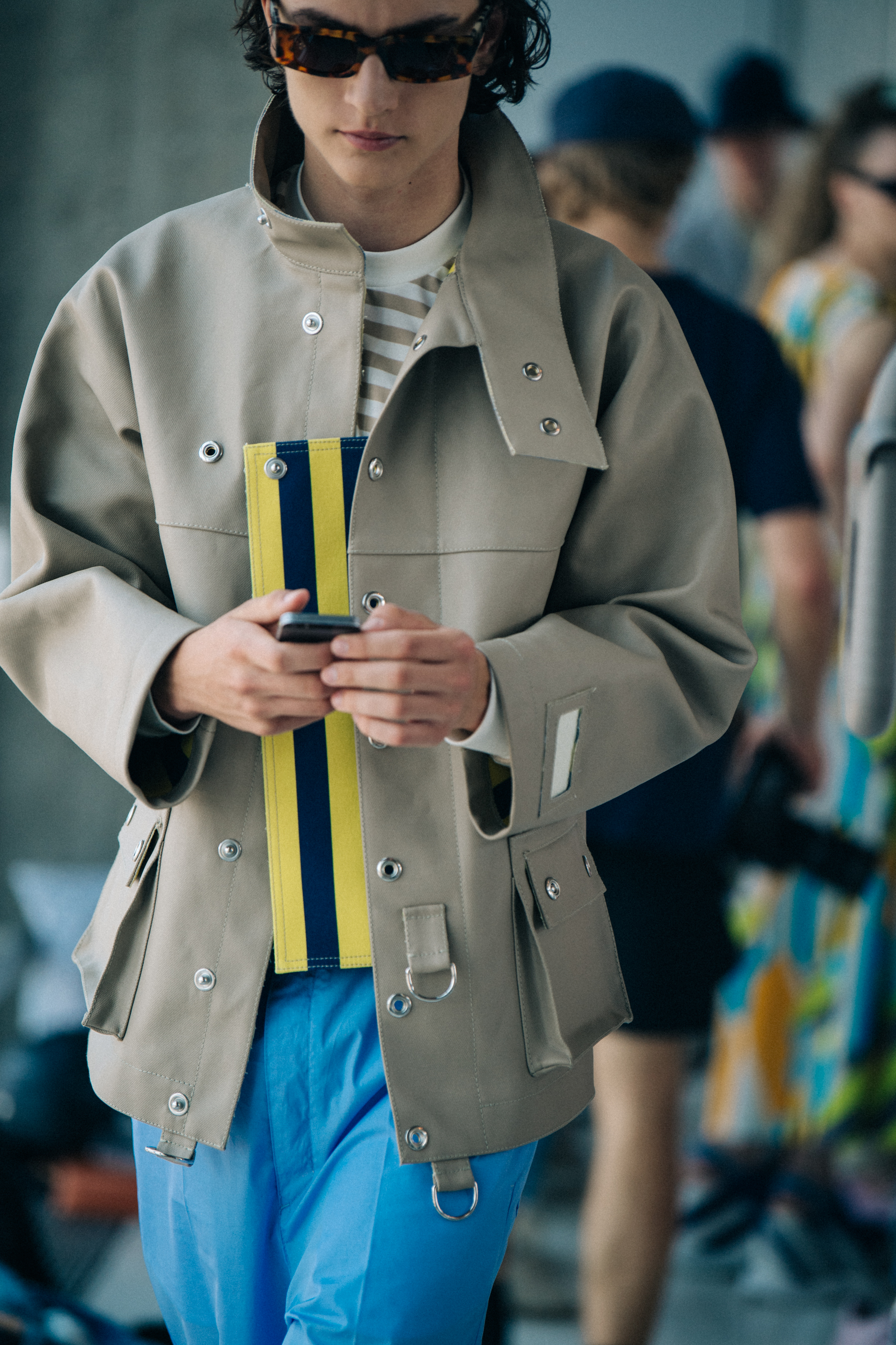 Model wearing sunglasses backstage at Sunnei
