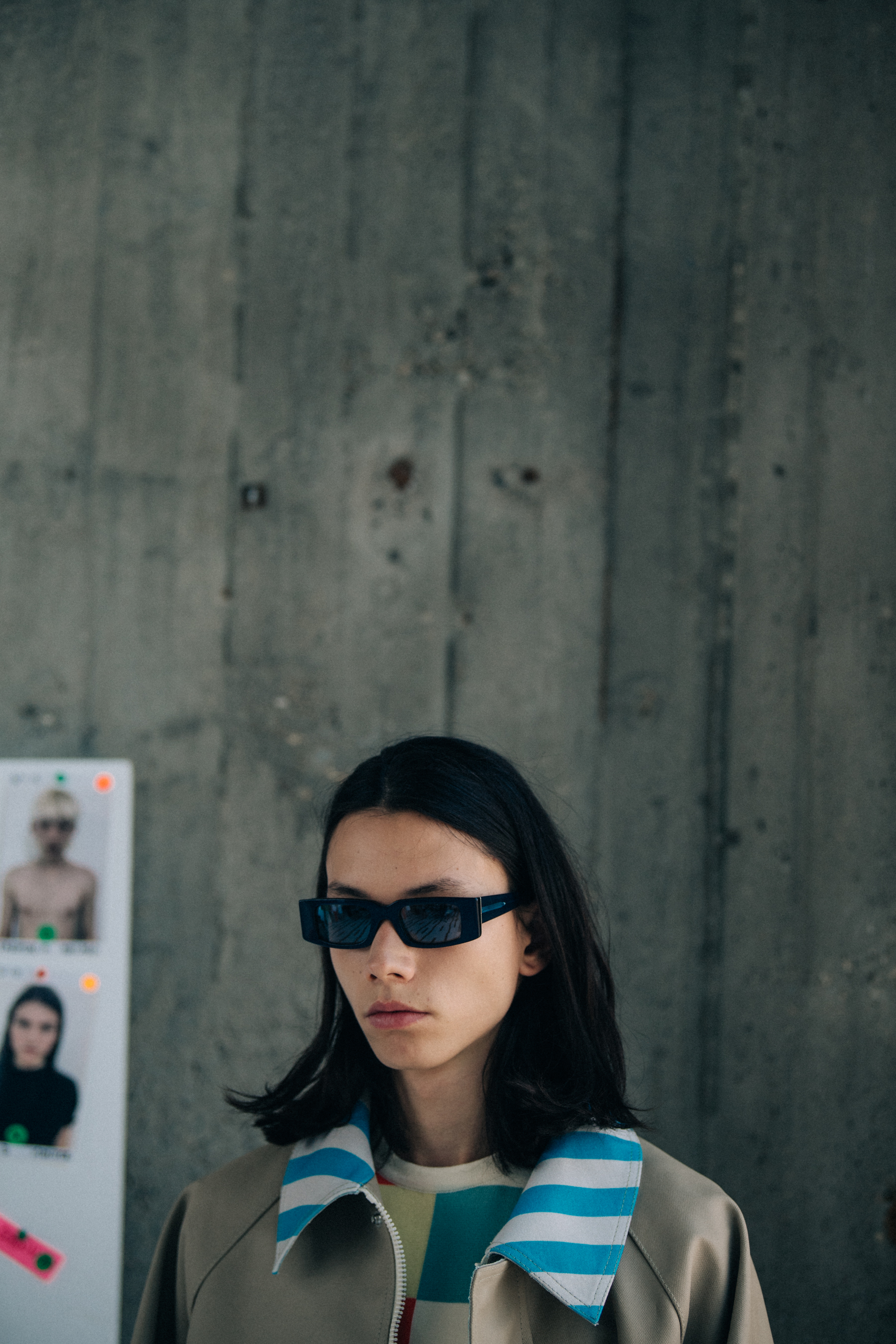 Model wearing sunglasses backstage at Sunnei