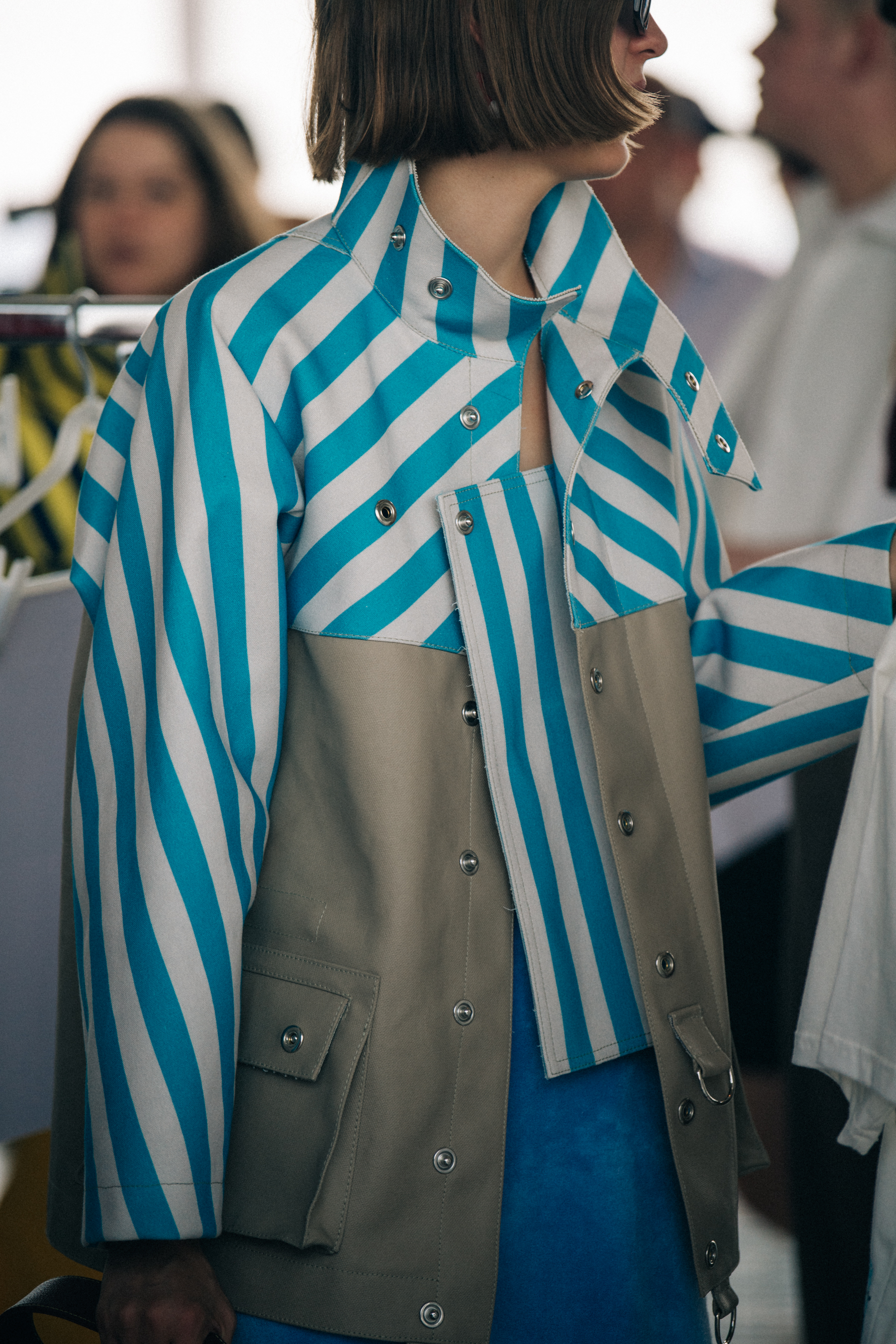 Model wearing sunglasses backstage at Sunnei