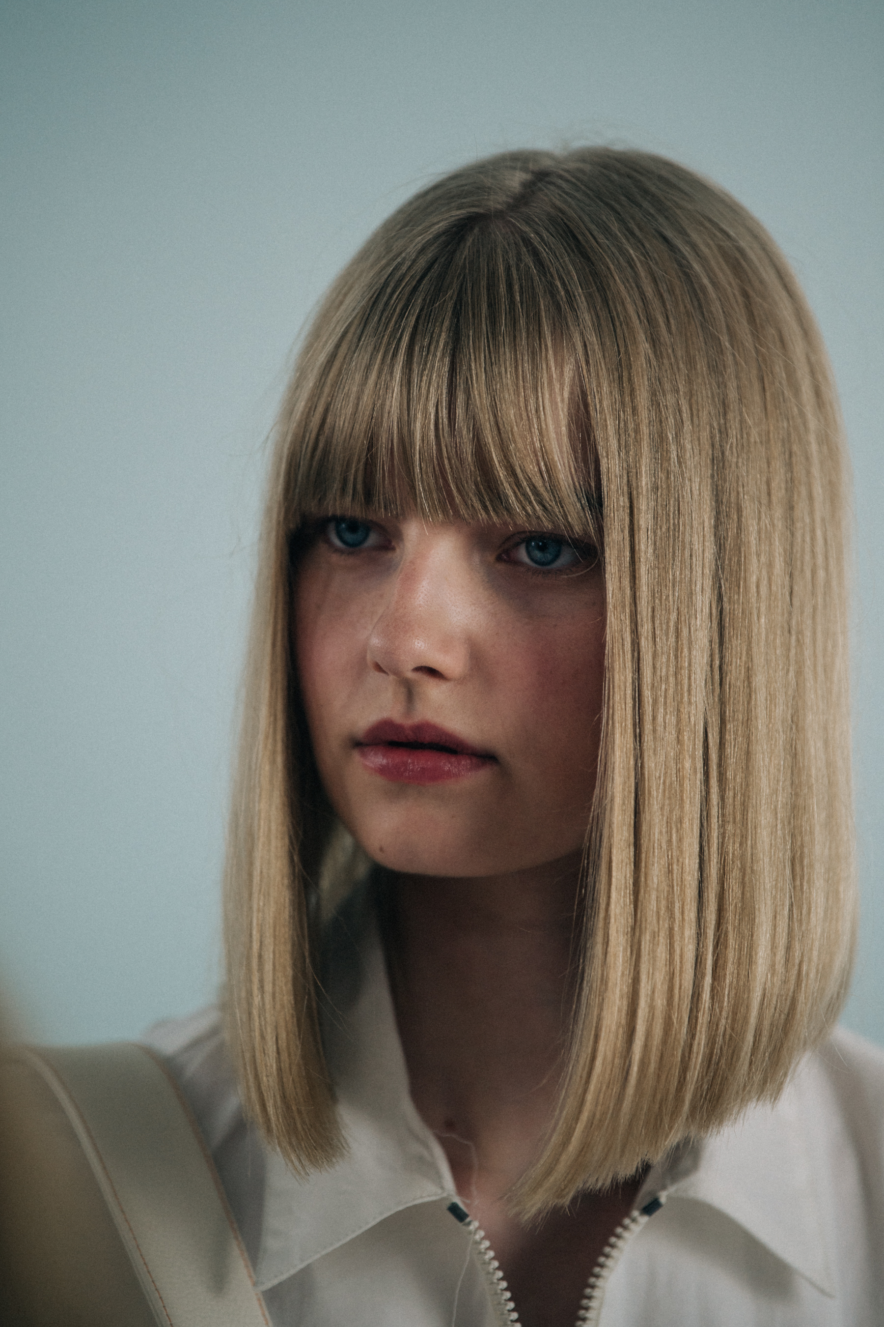 Model with blonde hair backstage at Sunnei