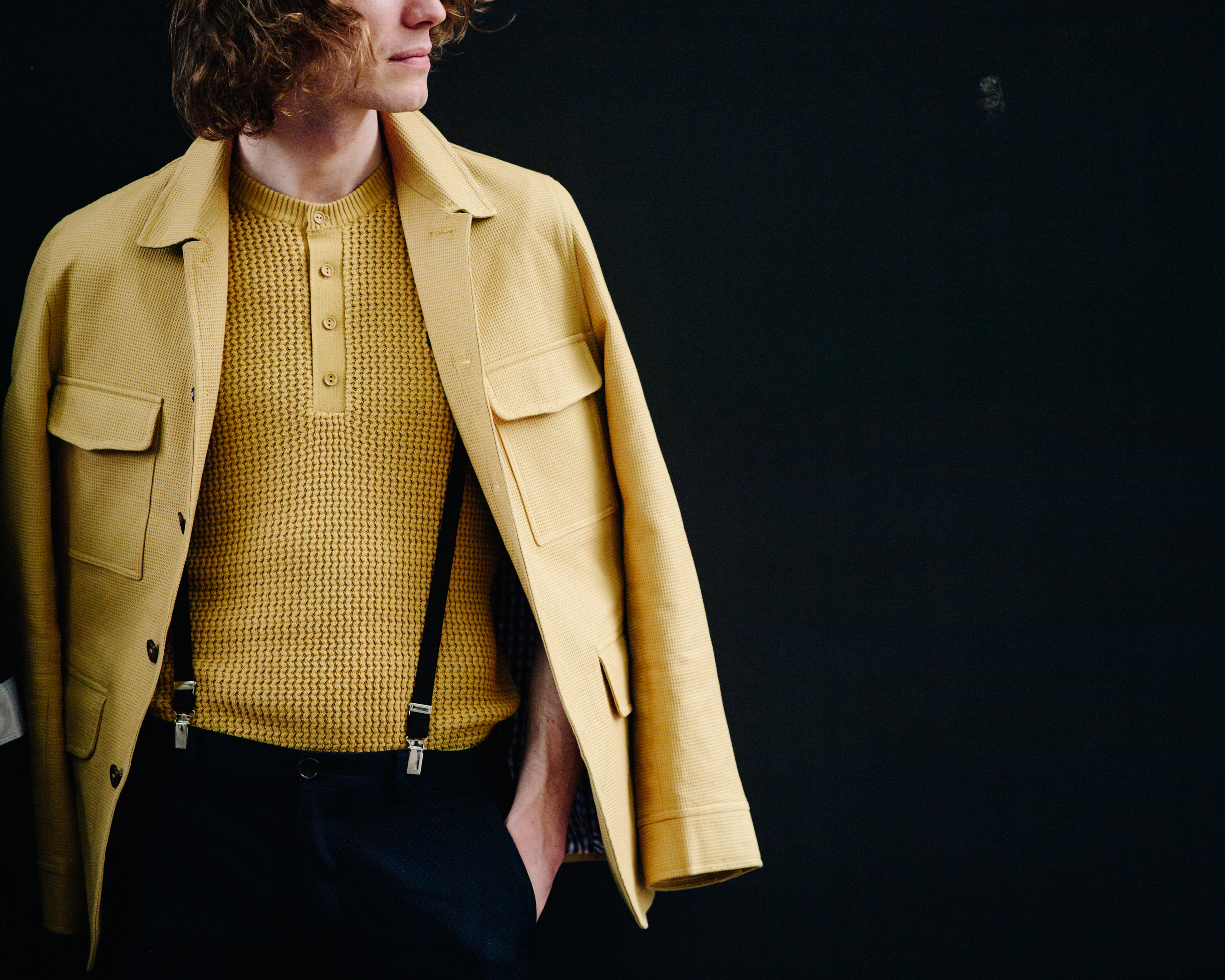 Man wearing yellow jumper