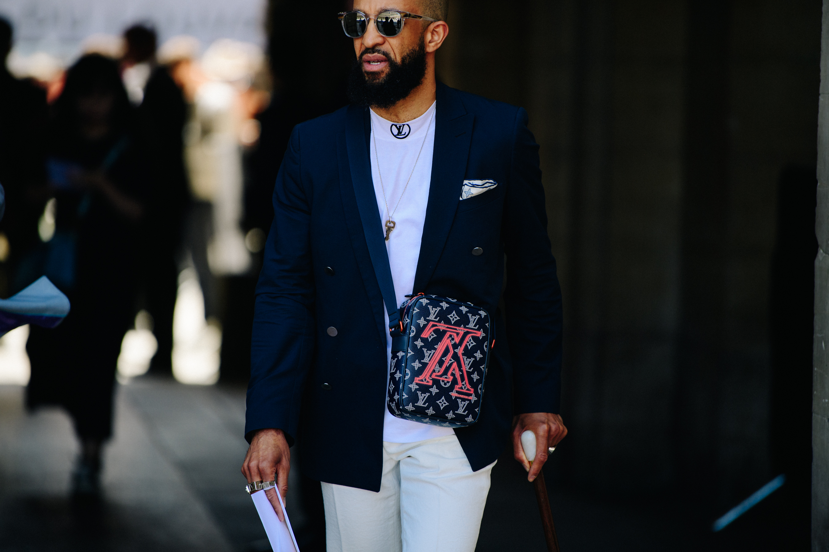 Man carrying Louis Vuitton bag