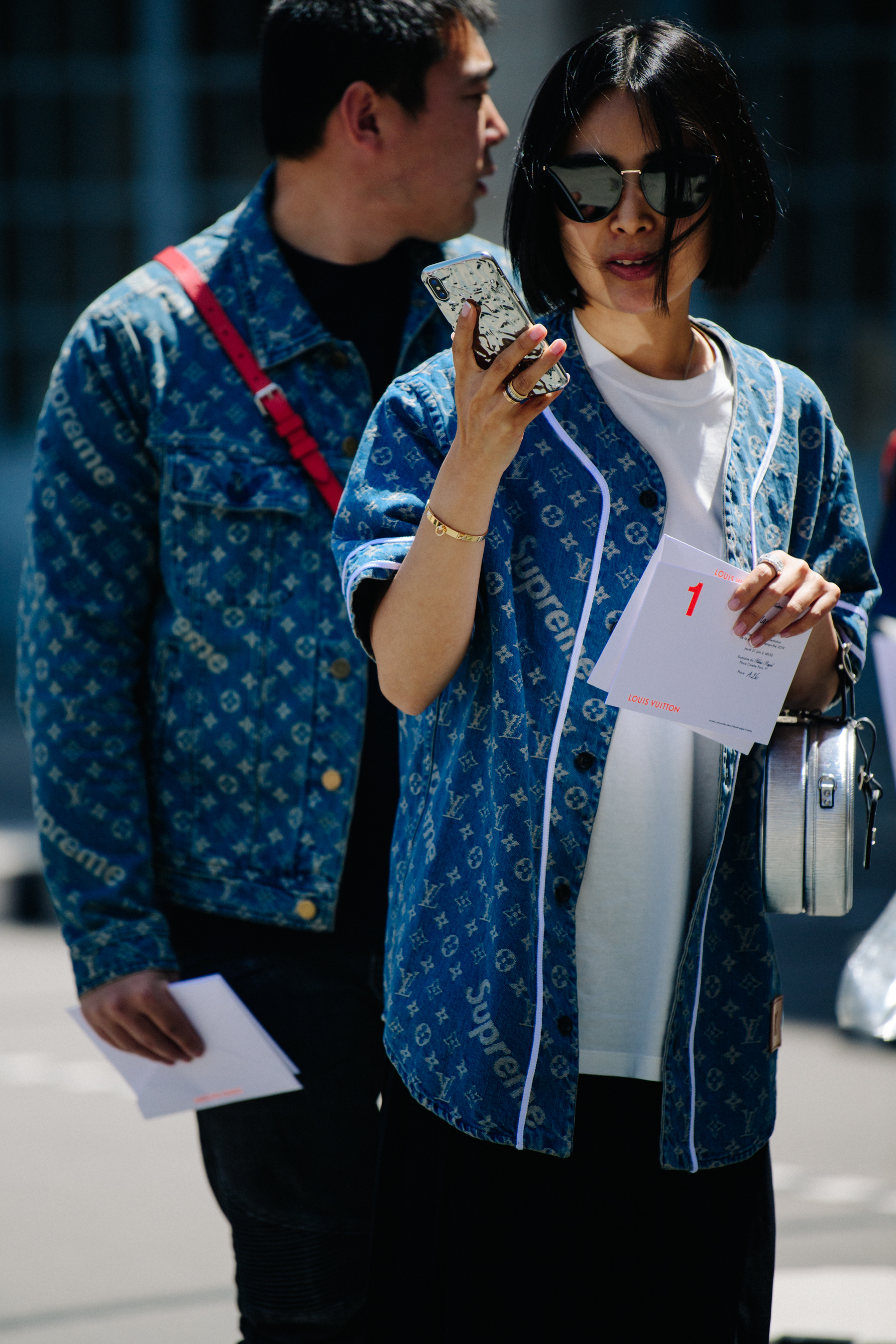 Asian couple wearing Louis Vuitton