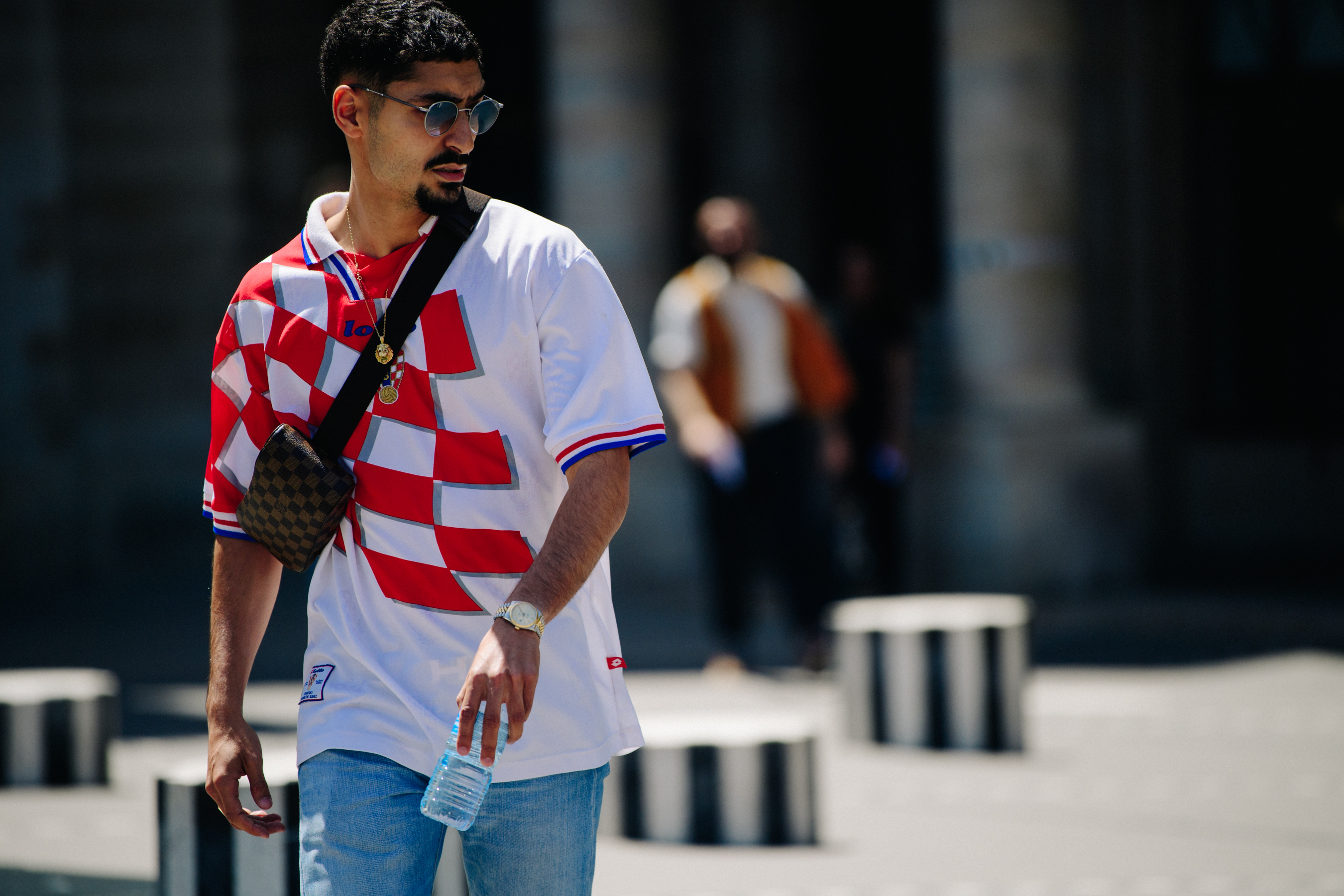 Man wearing Lotto football shirt