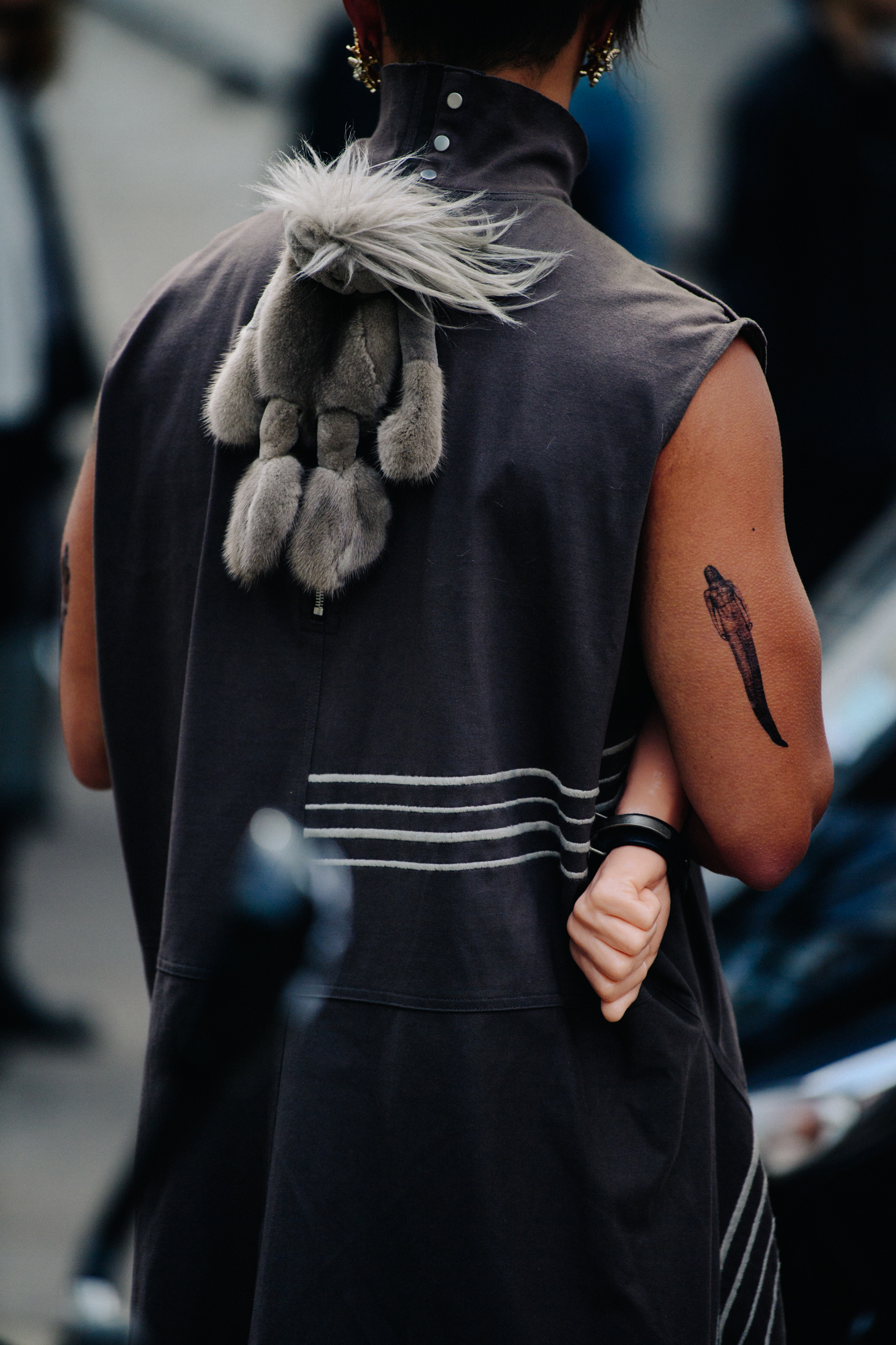 Man wearing black sleeveless top