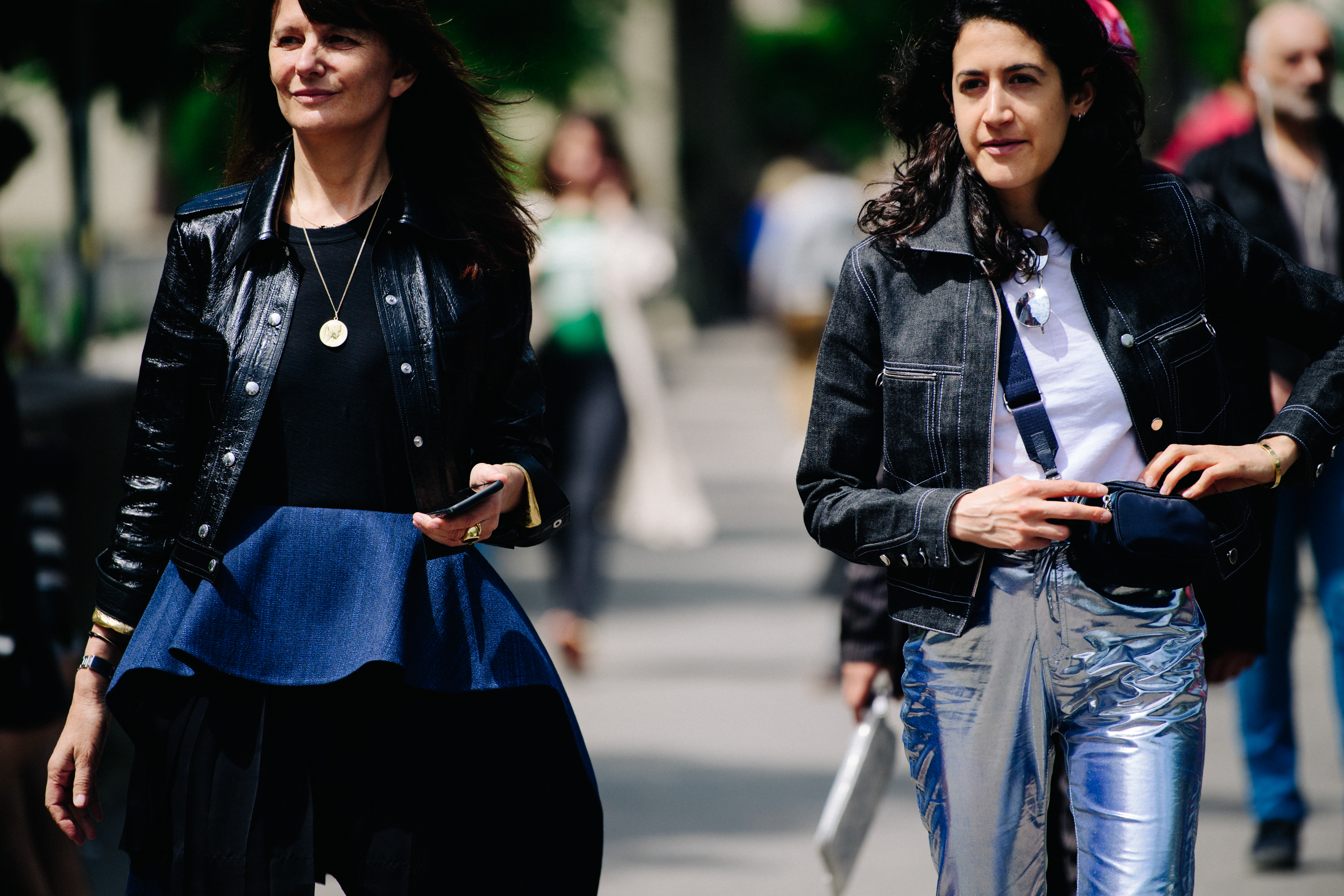 Two women wearing black jackets