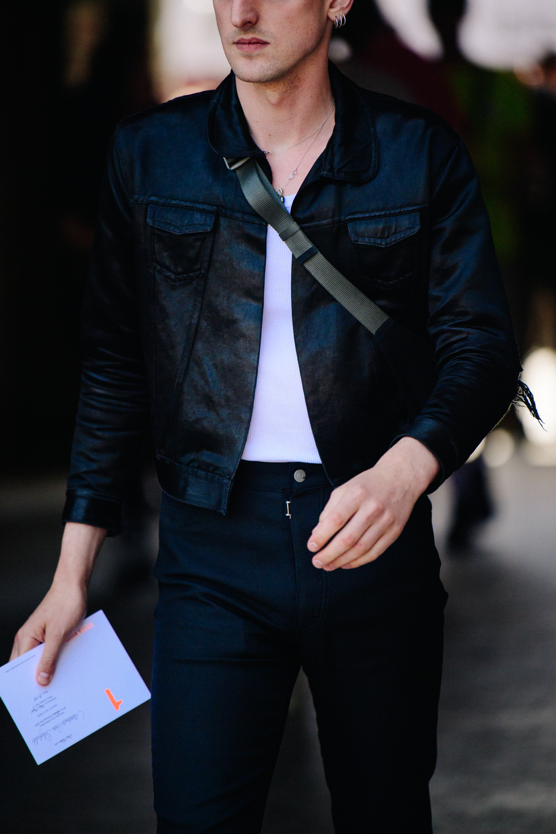 Stylist wearing dark leather jacket