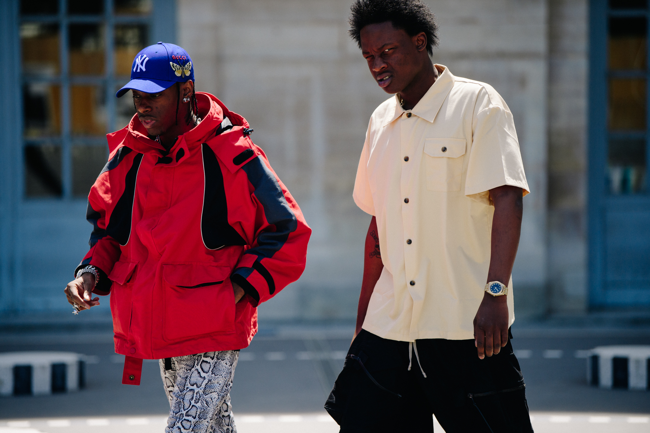 Two men wearing red and yellow