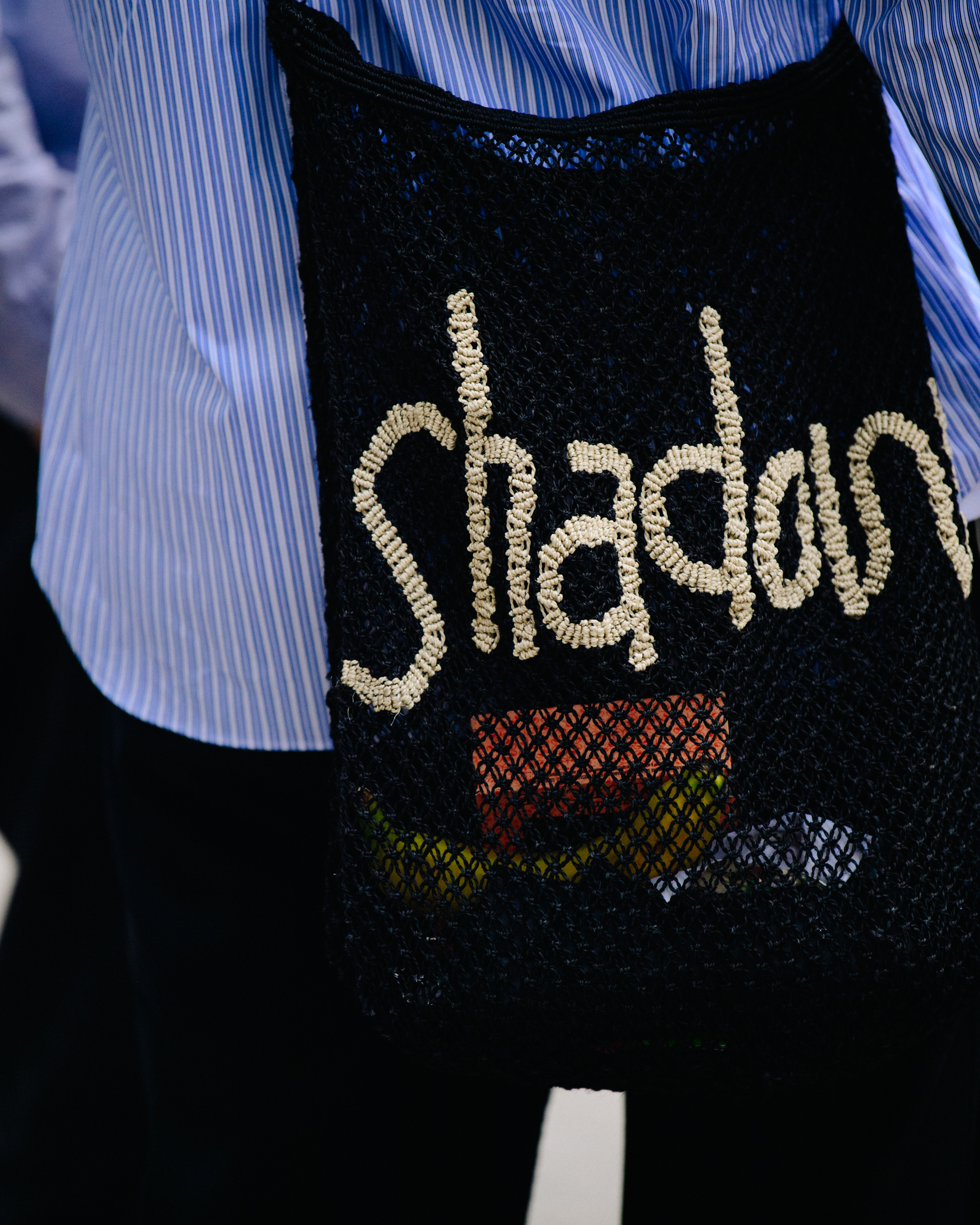 Man carrying black bag