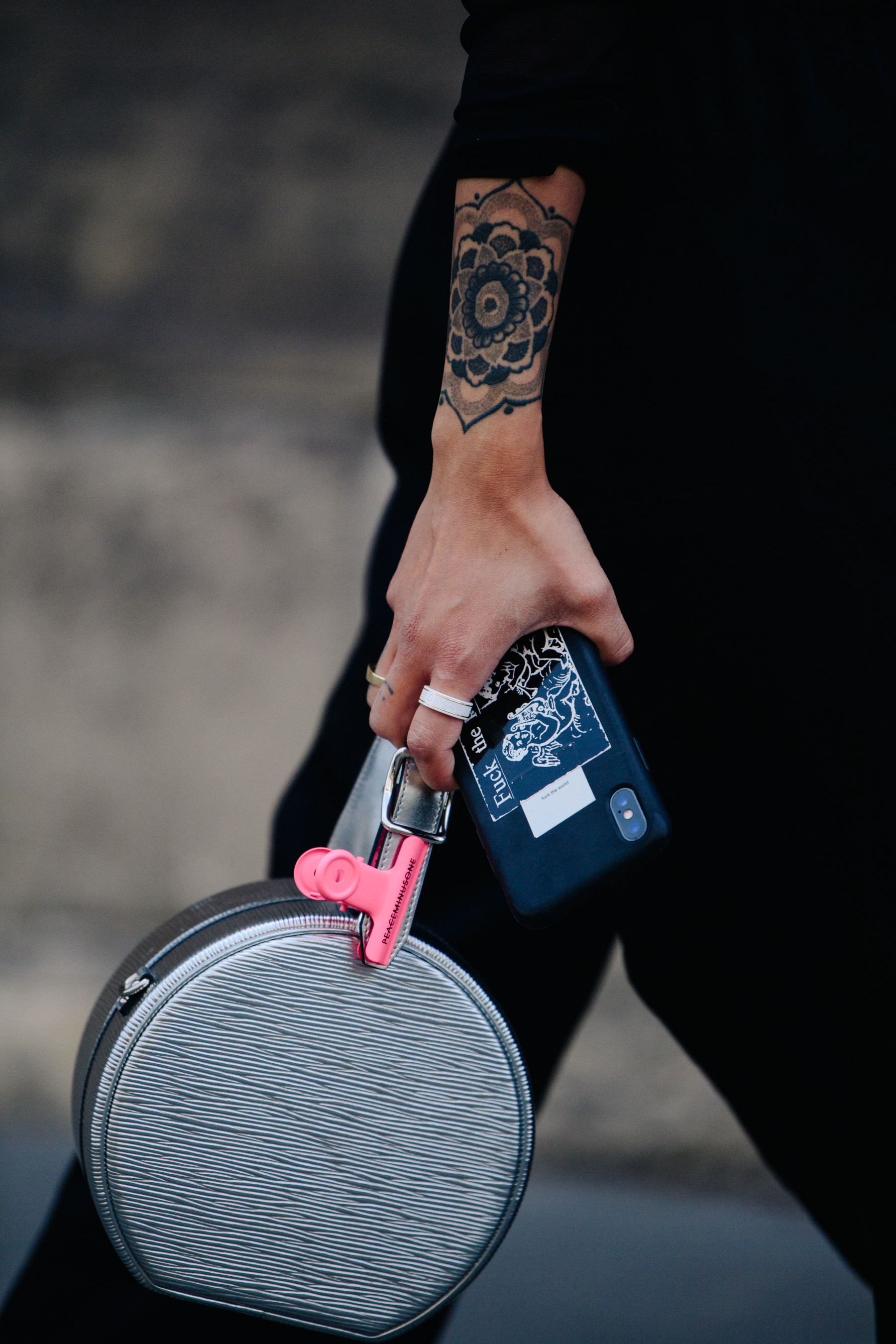 Woman carrying silver bag