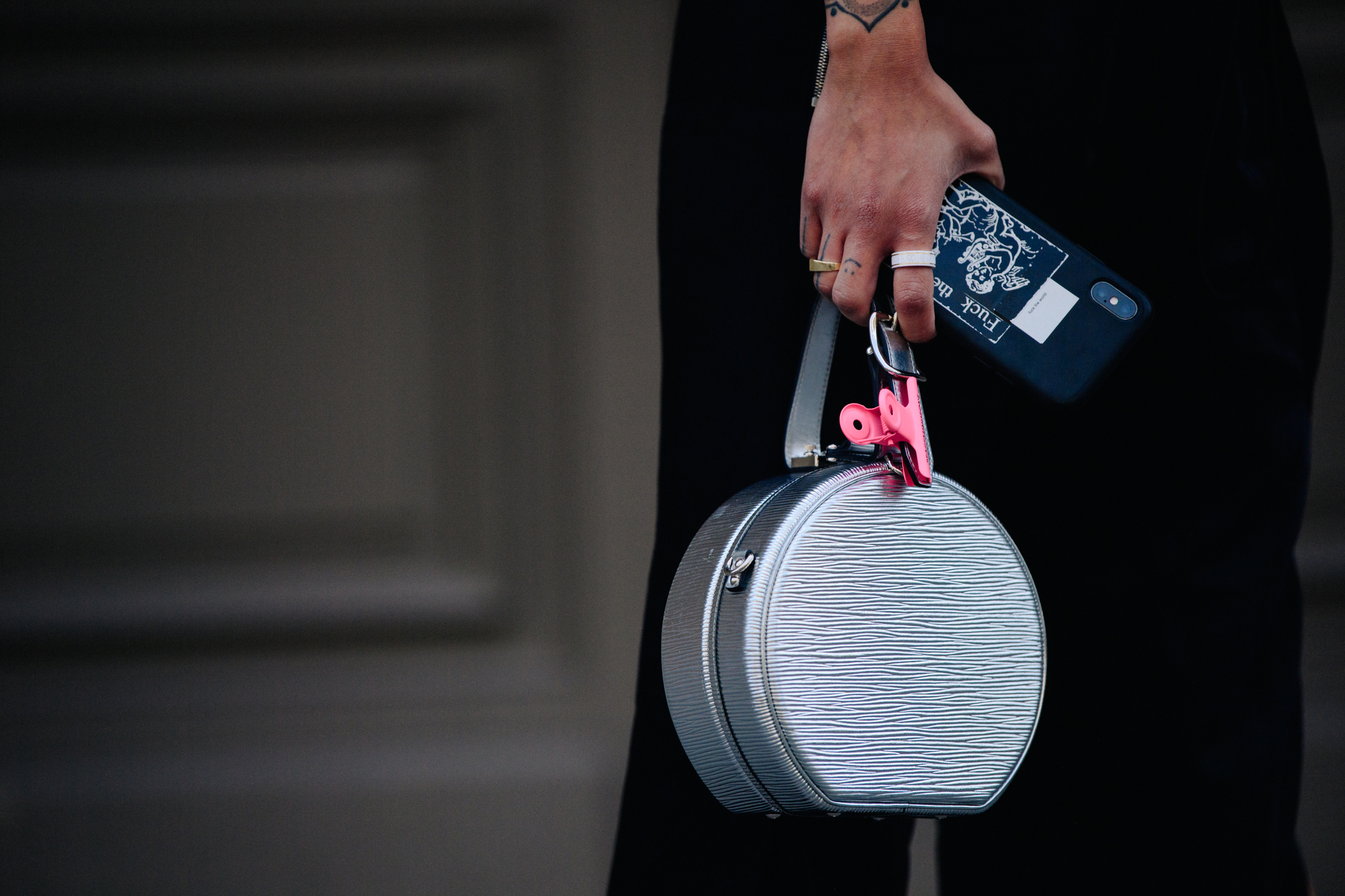 Woman carrying silver bag