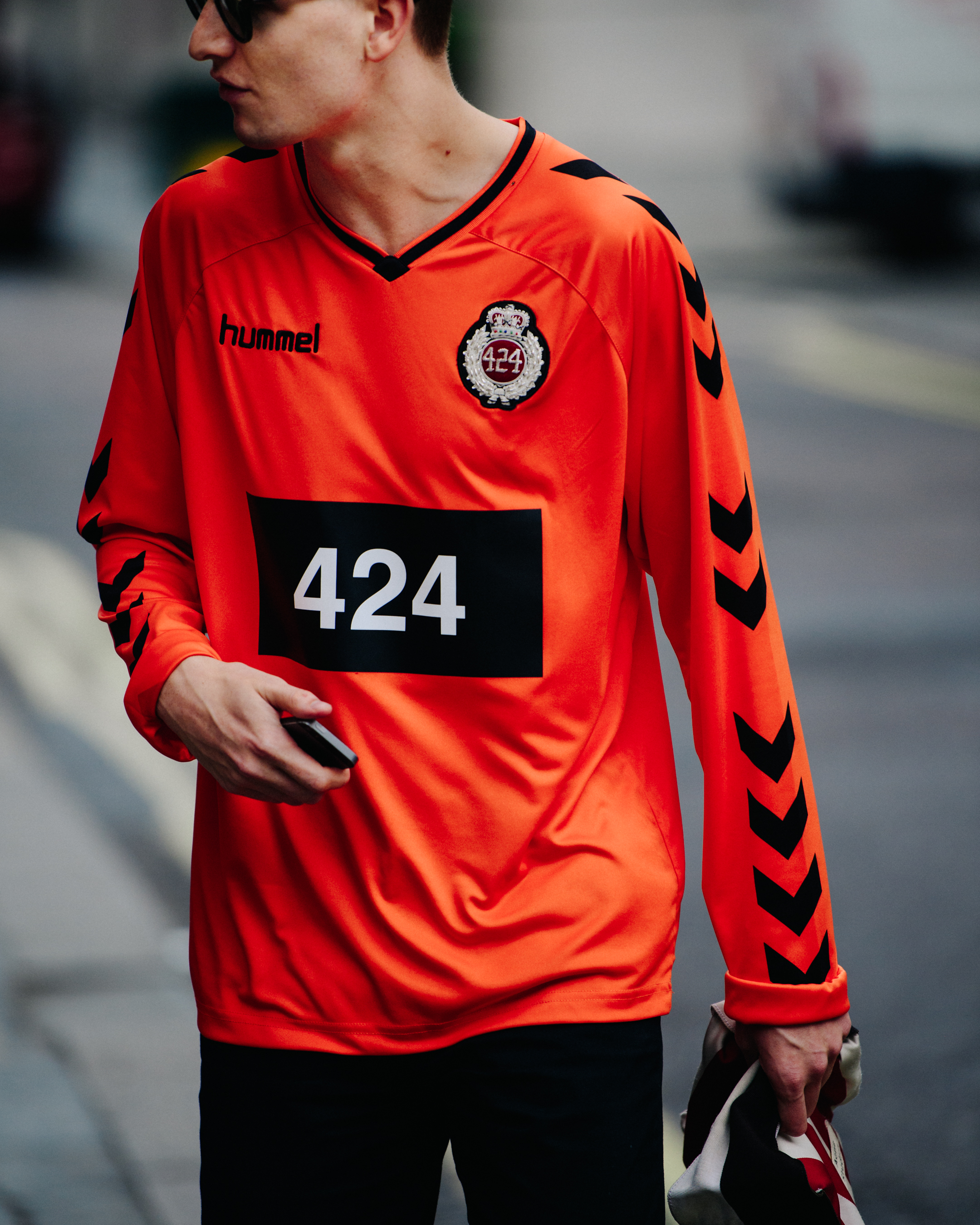Man wearing orange shirt