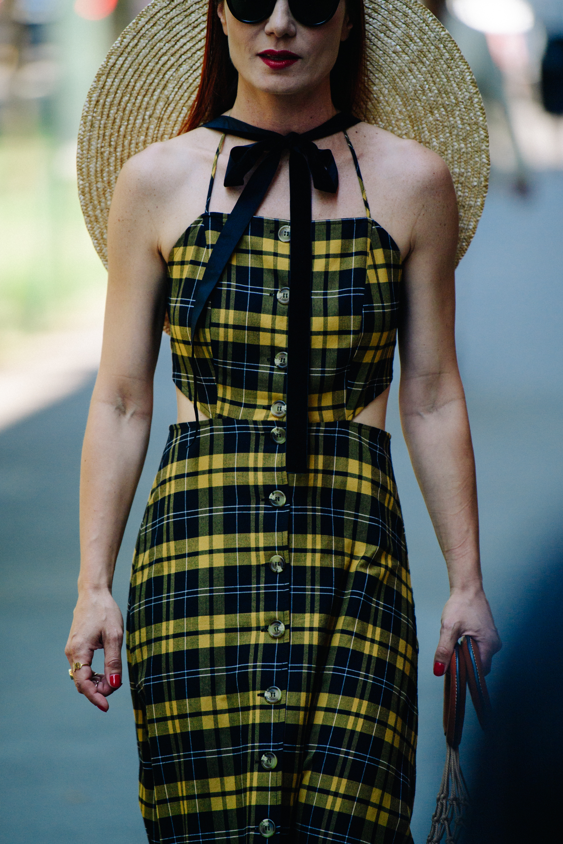 Woman wearing yellow check dress