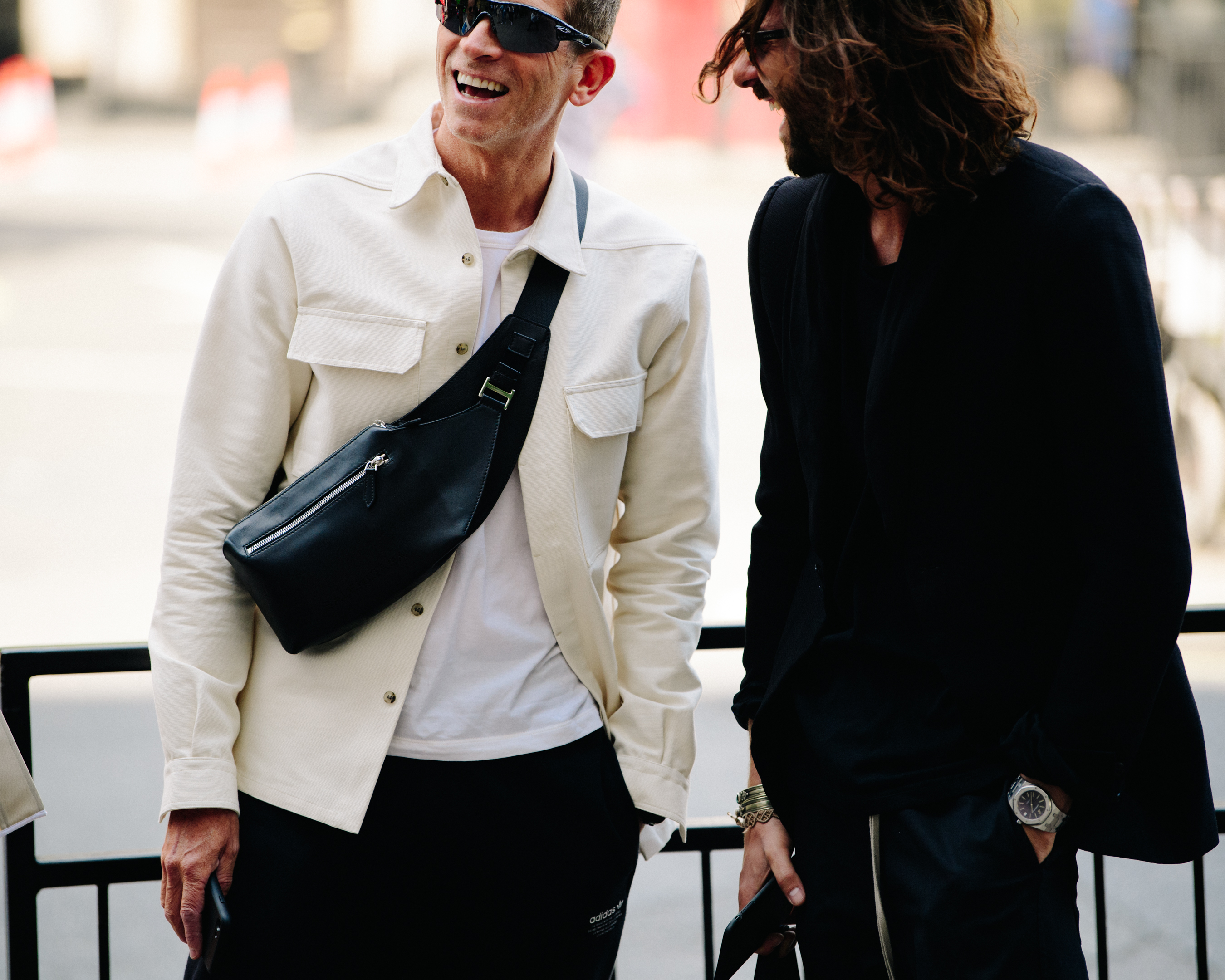 Two men wearing black and white