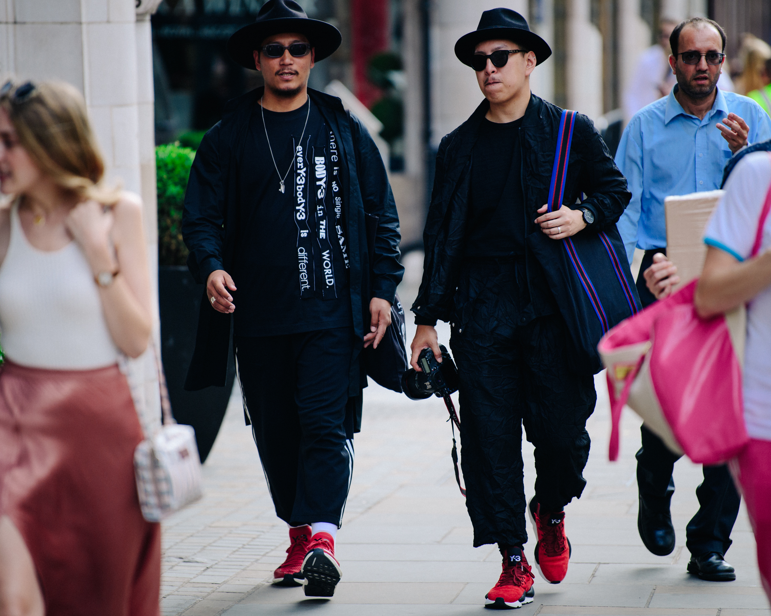 Two men wearing black Y3 outfits