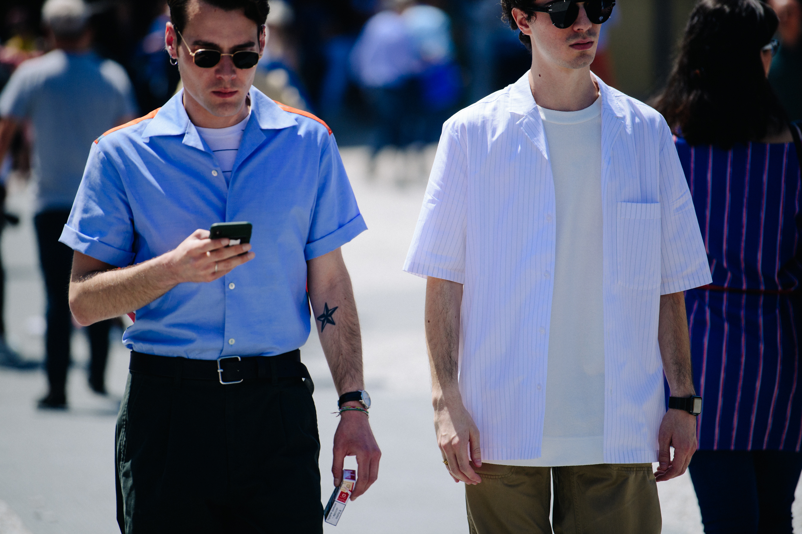 Two men wearing short sleeve shirts