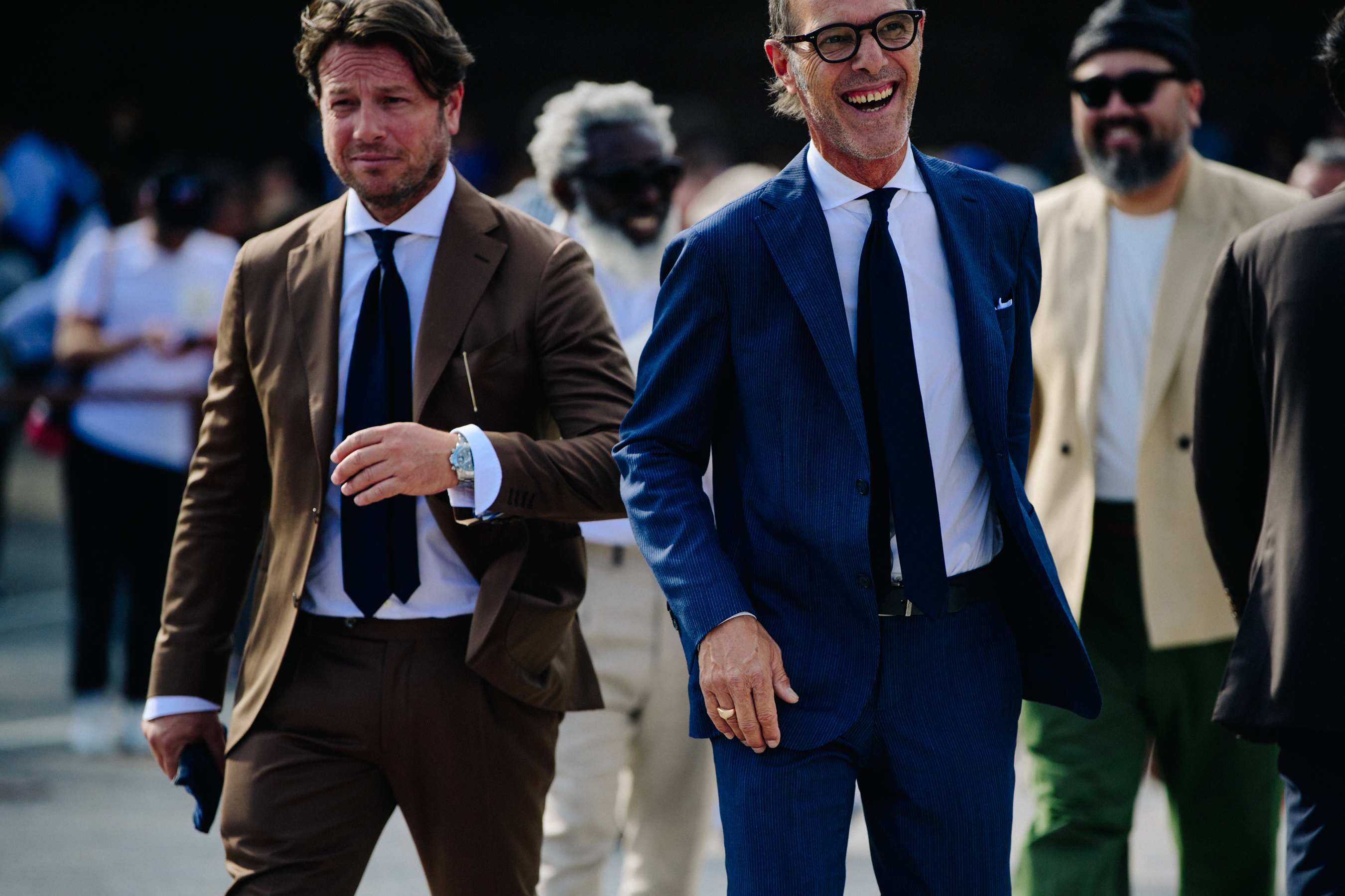 Men wearing blue and brown suits