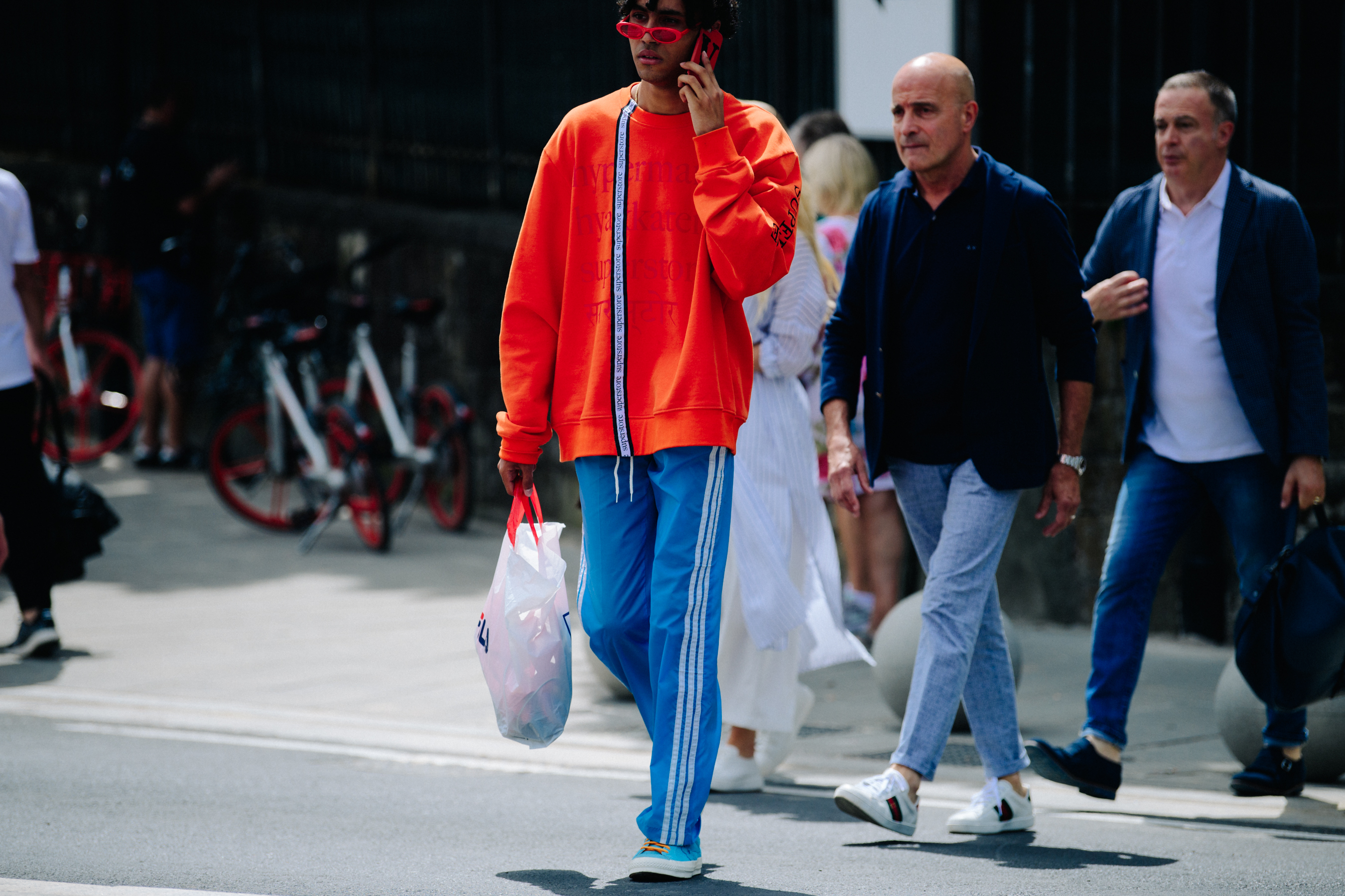 Man wearing orange jumper