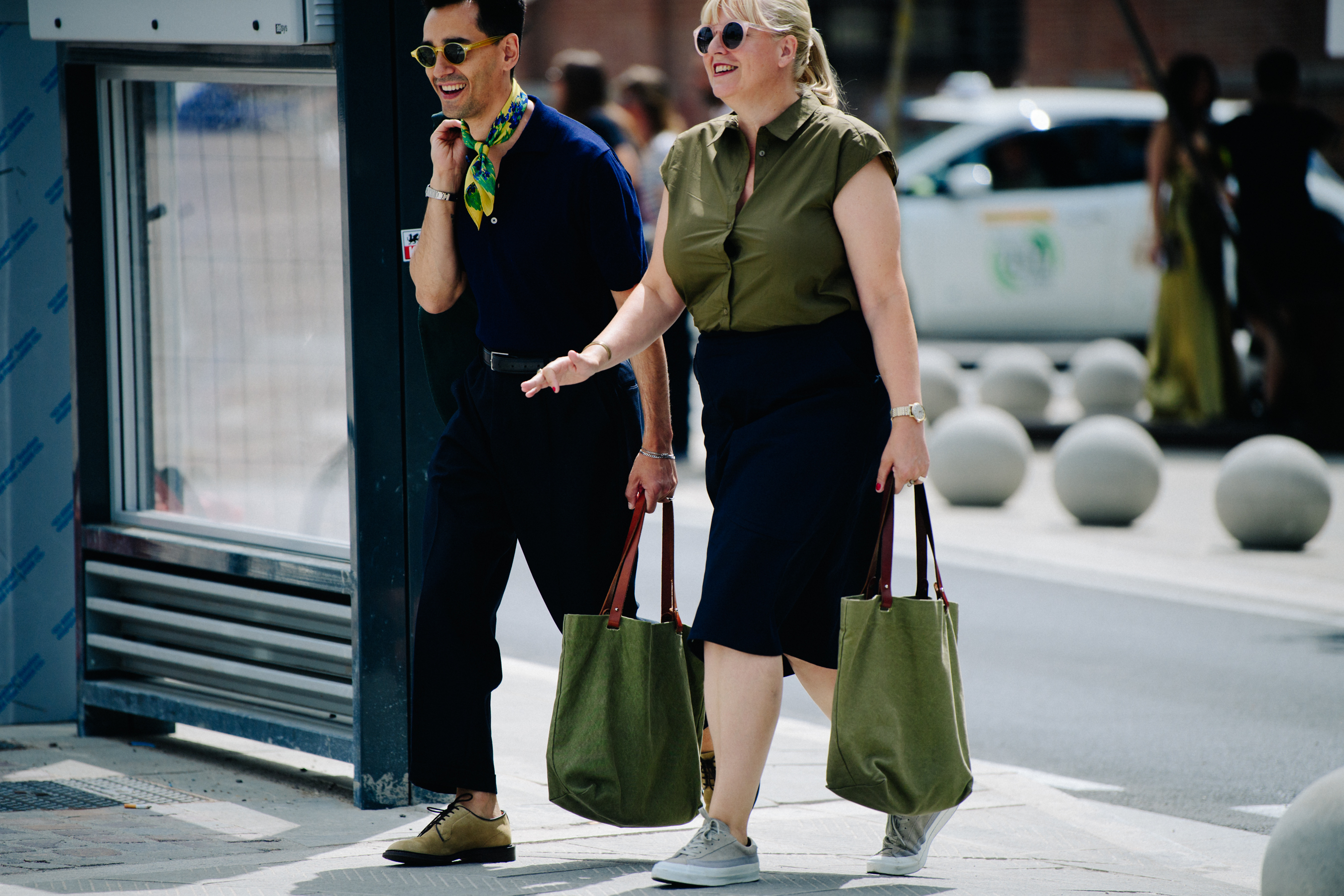 Couple carrying matching bags