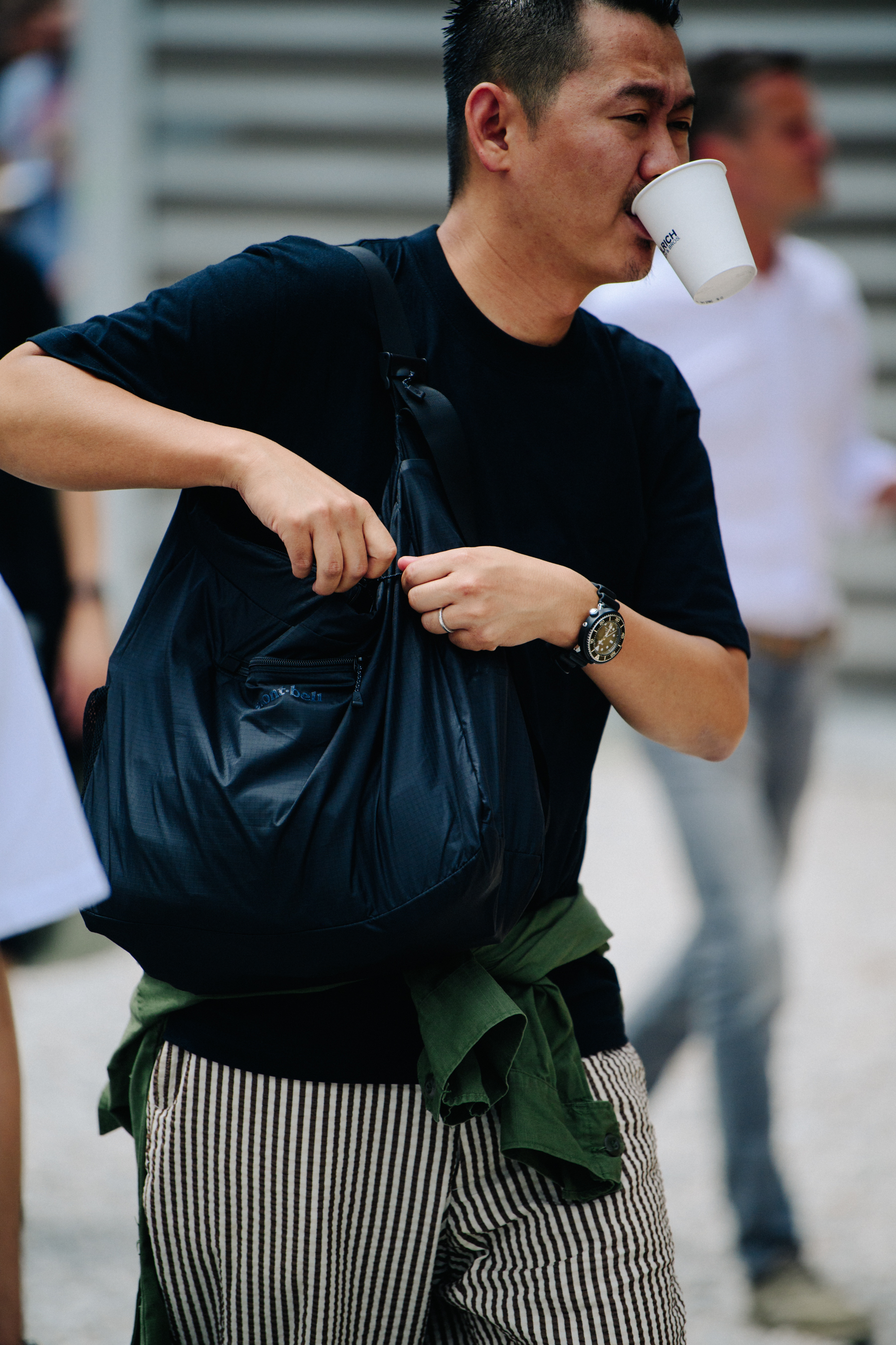 Man carrying black bag