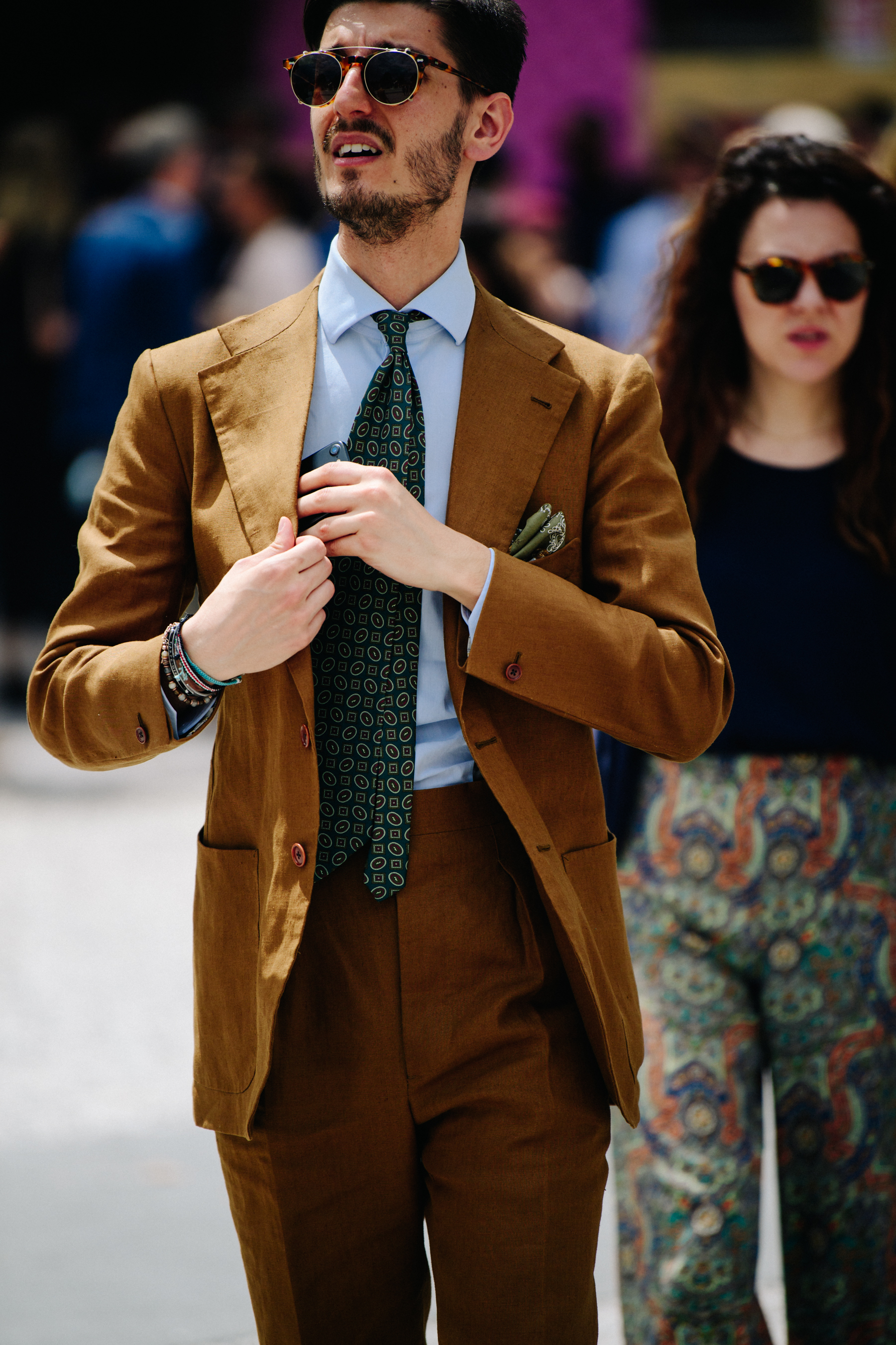 Man wearing brown suit