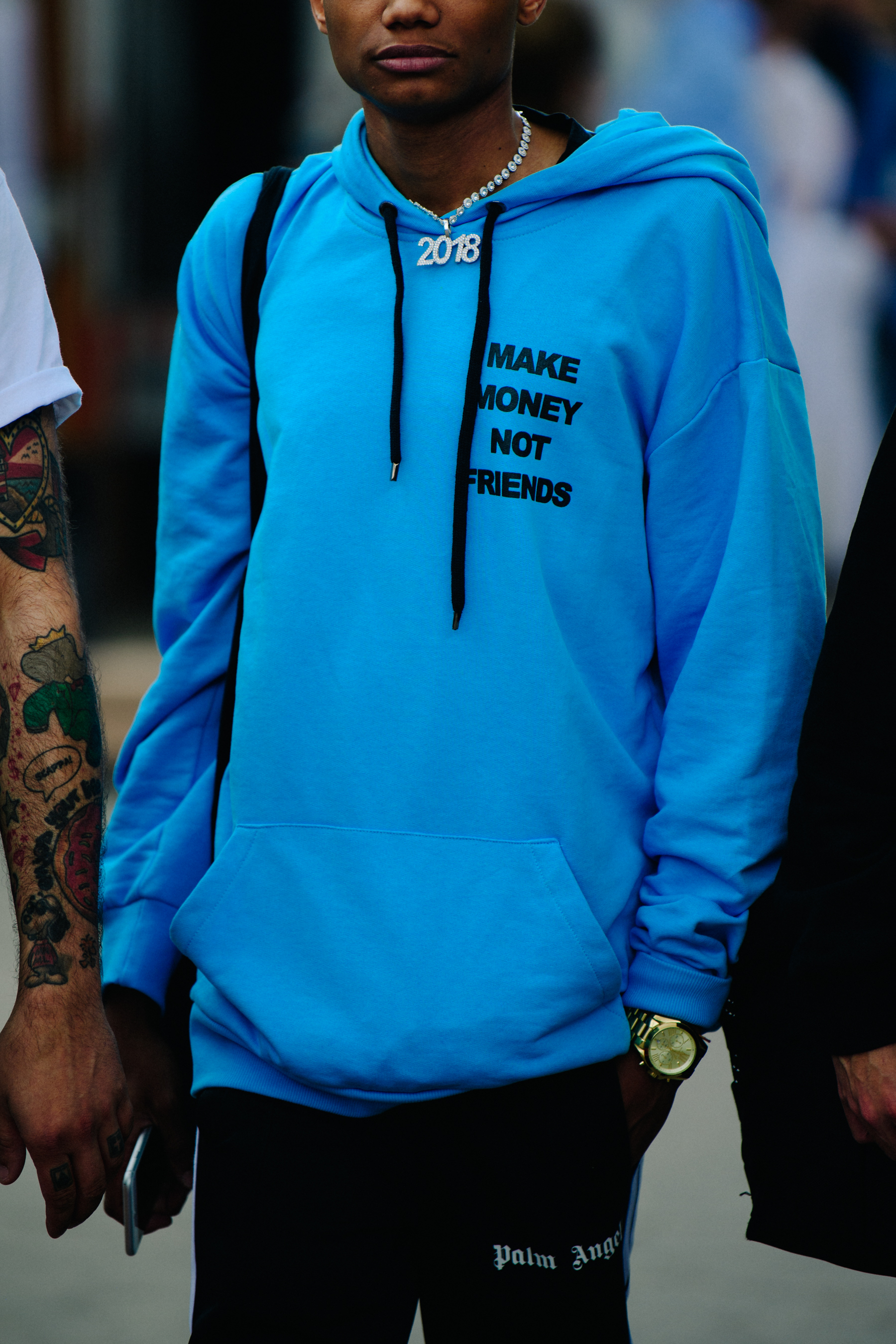 Man wearing blue hoodie