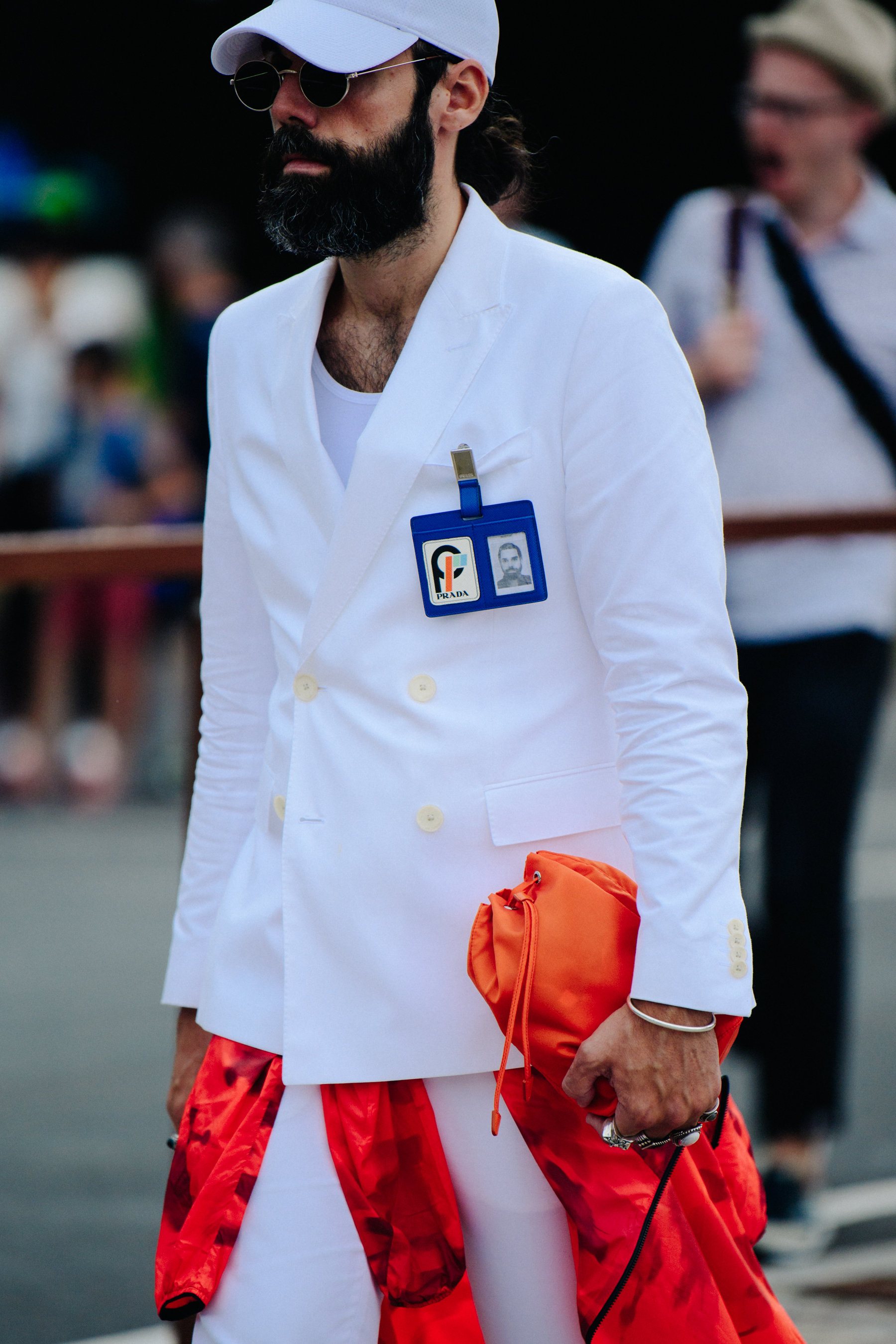 Man carrying orange bag