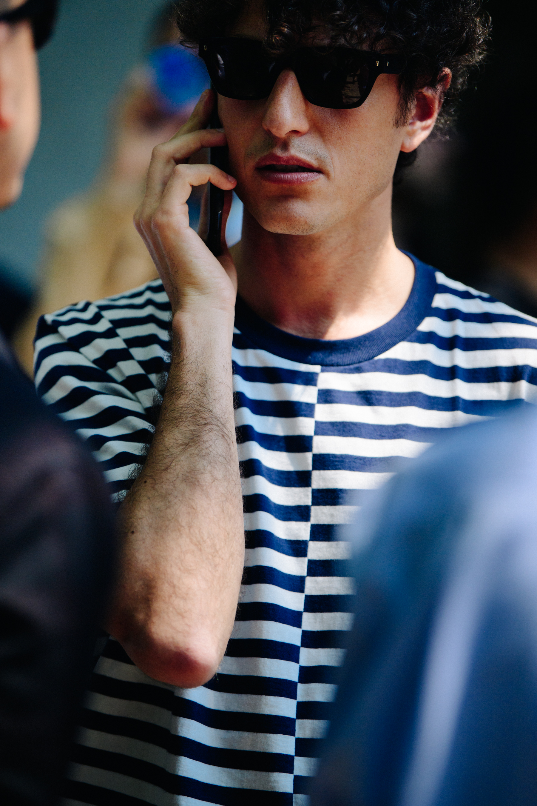 Man wearing striped tee shirt