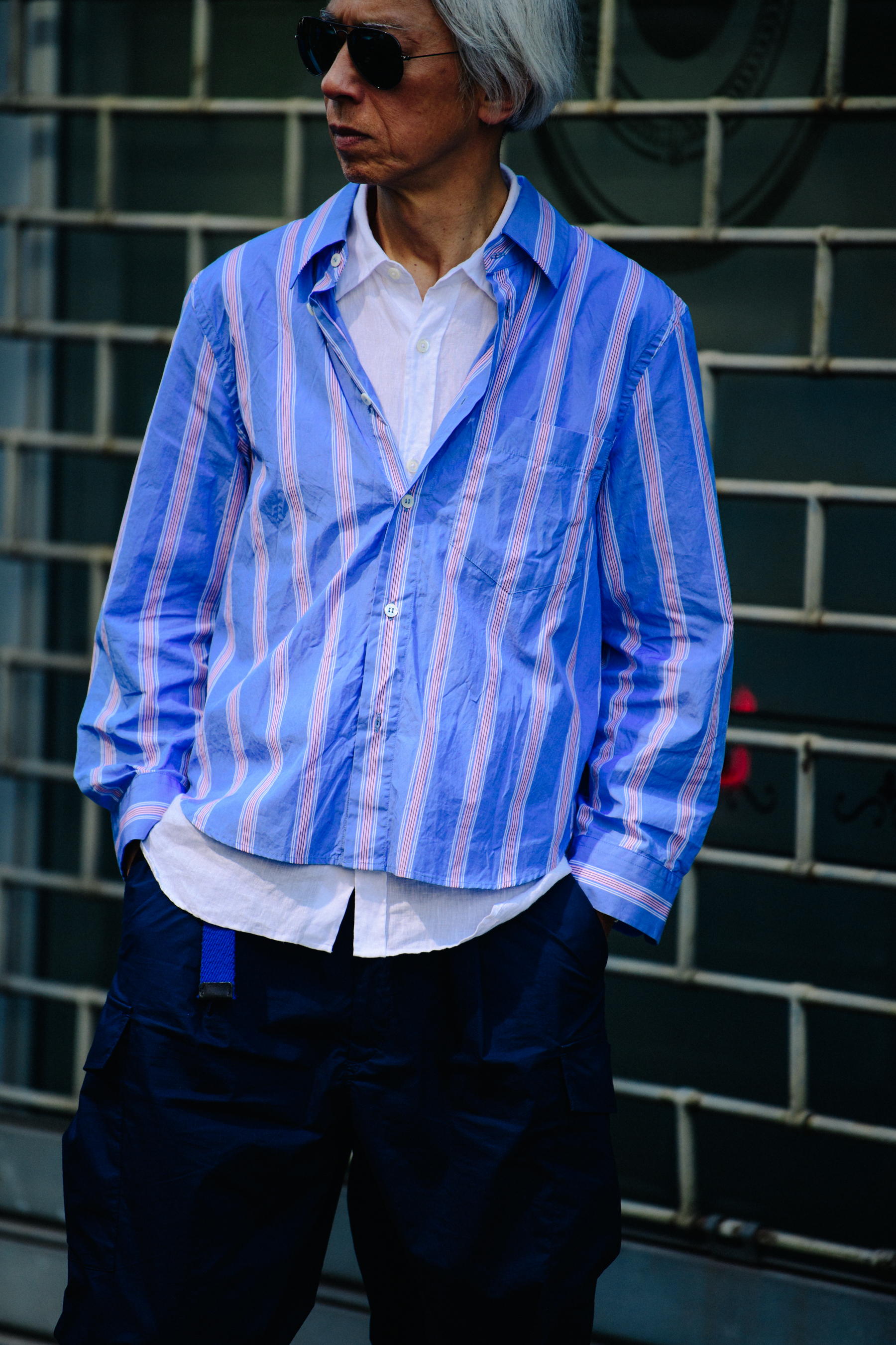 Man wearing blue stiped outfit